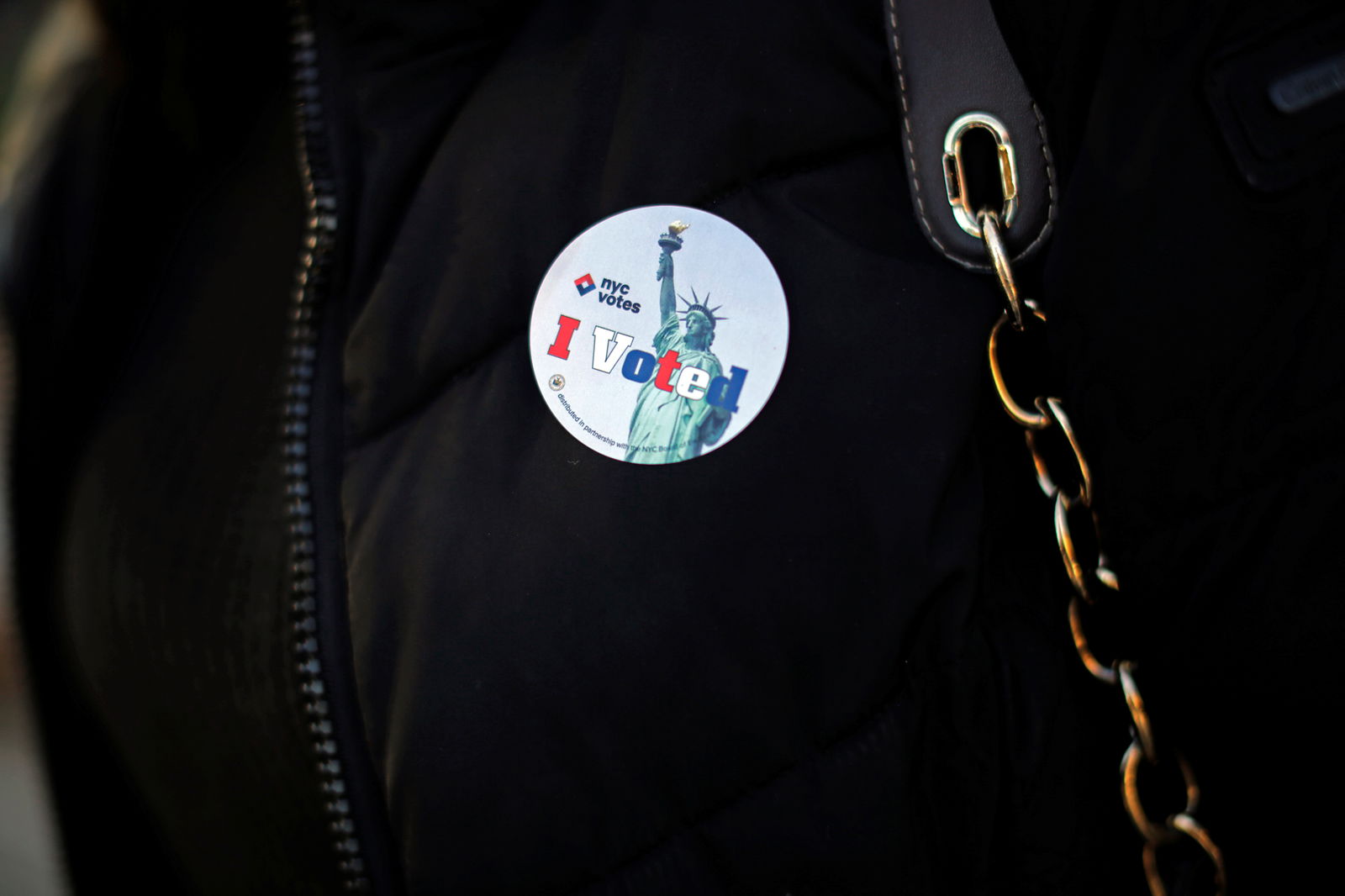 FILE PHOTO: A sticker is seen on a woman's jacket after she cast her ballot during the U.S. presidential election at a polling station in the Bronx Borough of New York, U.S., November 8, 2016. 