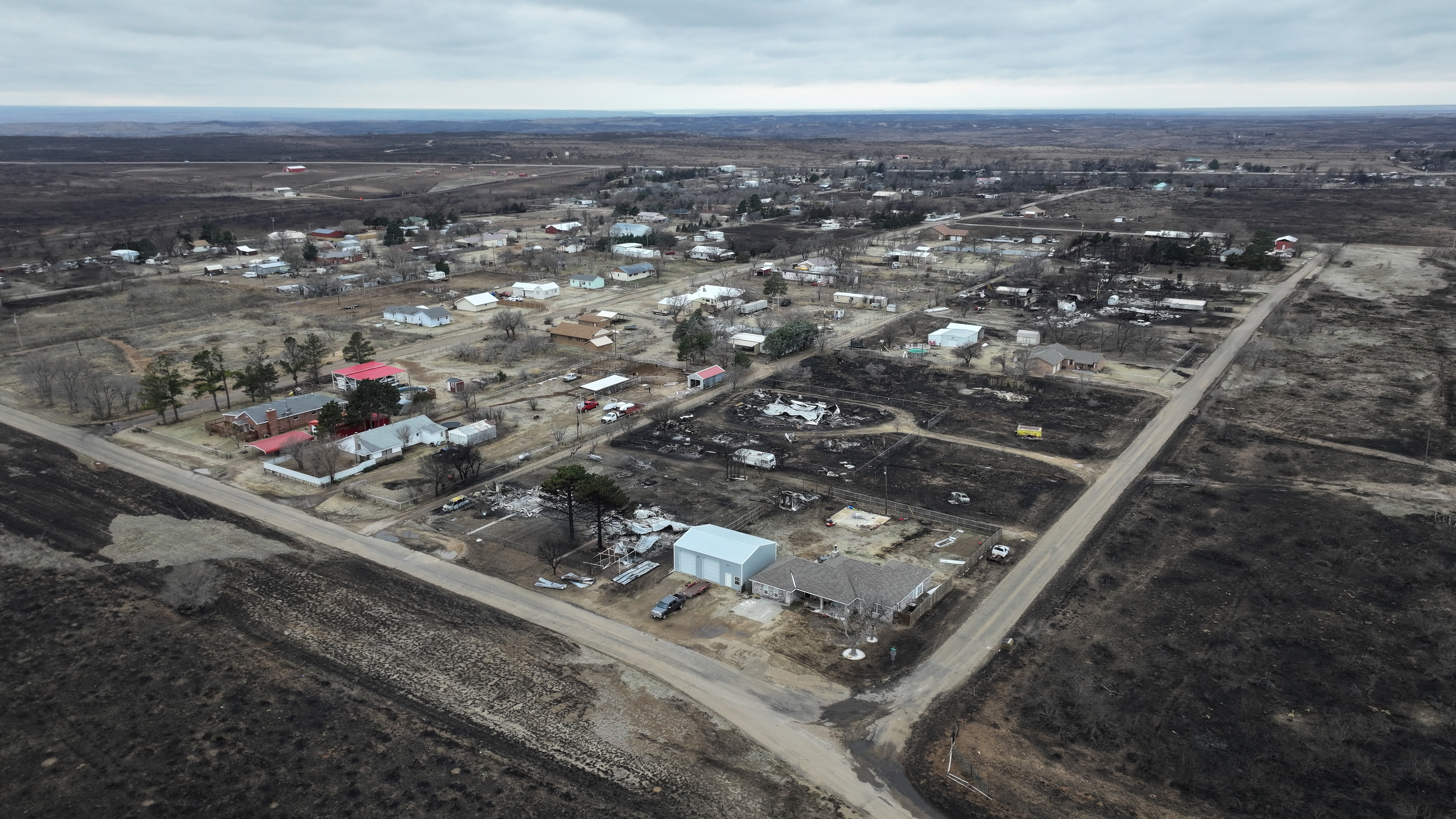 A drone view shows homes damaged by the Smokehouse Creek Fire, in Stinnett, Texas, United States February 29, 2024. 