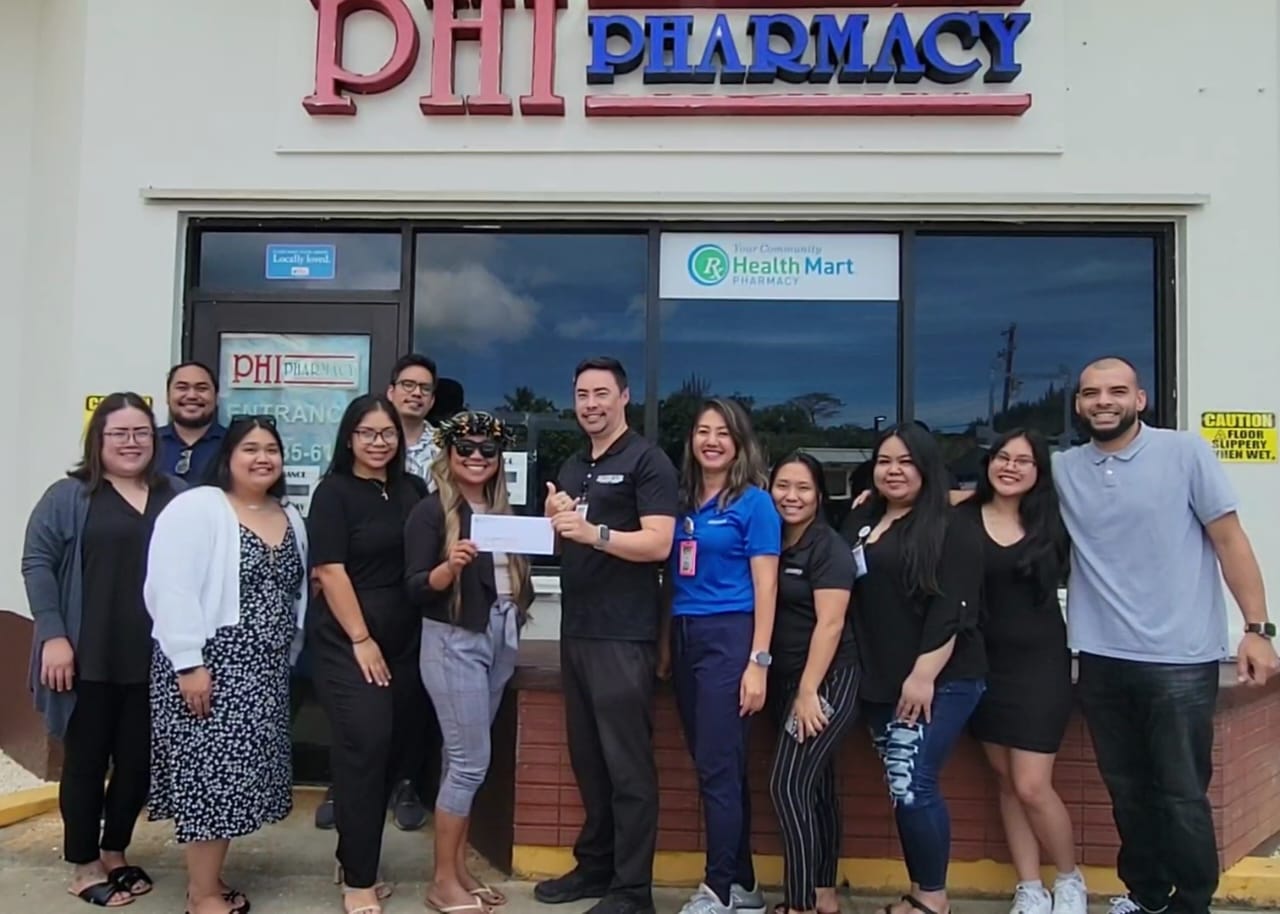 Front and center: Jenypy Sambile, MMAC Steering Committee chair and Joshua Wise, PHI pharmacist and manager.