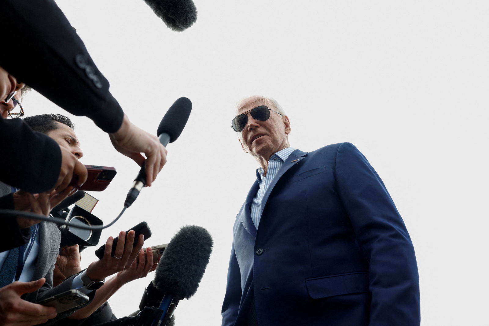 FILE PHOTO: U.S. President Joe Biden speaks to the media as he prepares to depart Joint Base Andrews for a campaign event in Philadelphia, in Maryland, U.S., March 8, 2024. 