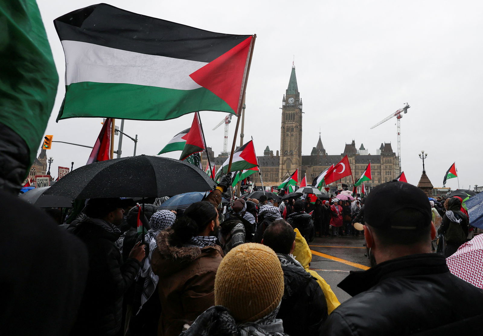 FILE PHOTO: Protesters hold Palestinian flags during a rally to call for a ceasefire, amid the ongoing conflict between Israel and the Palestinian Islamist group Hamas in Gaza, on Parliament Hill in Ottawa, Ontario, Canada March 9, 2024. 