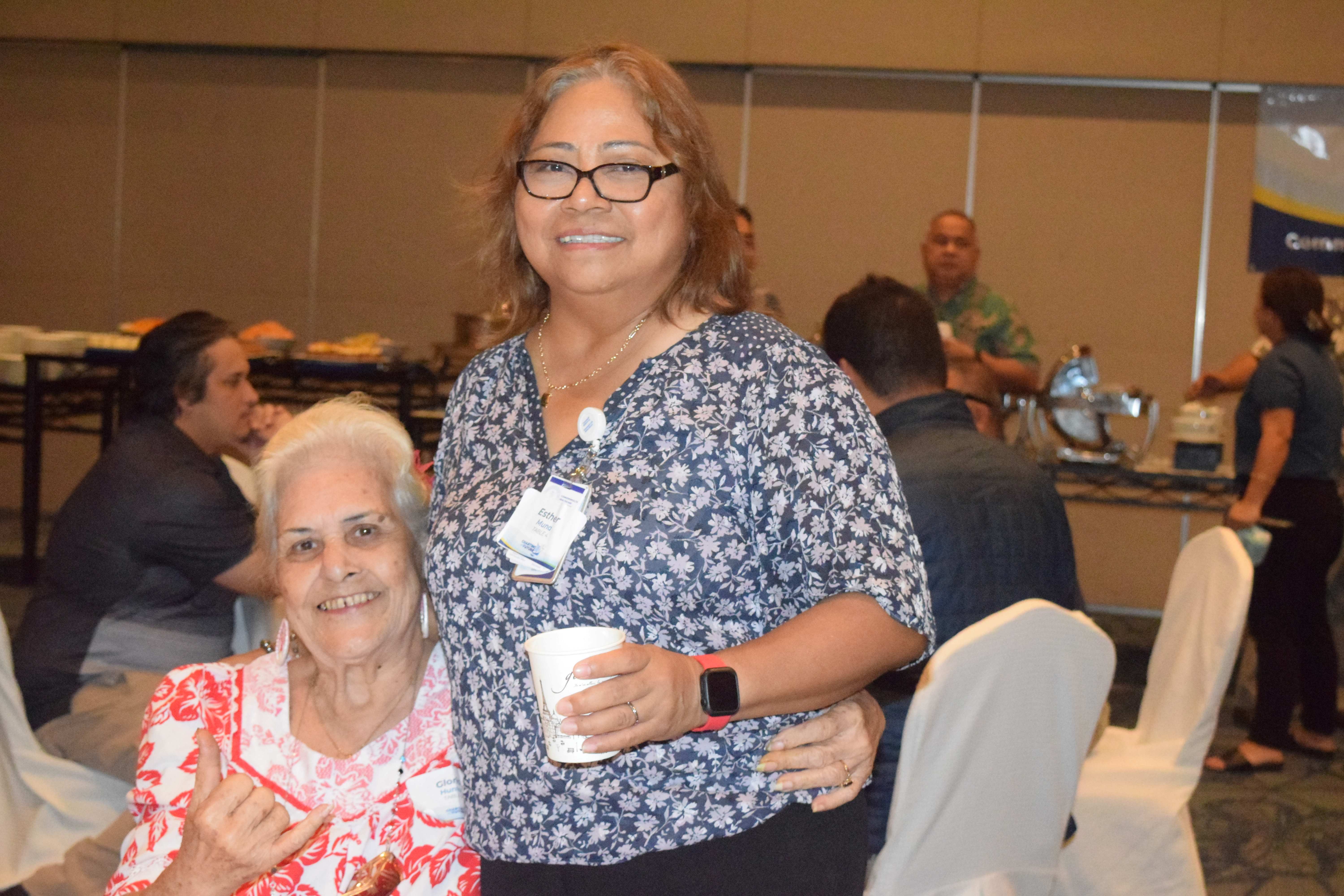 Commonwealth Healthcare Corp. Chief Executive Director Esther L. Muna, right, poses with Gloria Hunter, former special assistant for programs and legislative review.