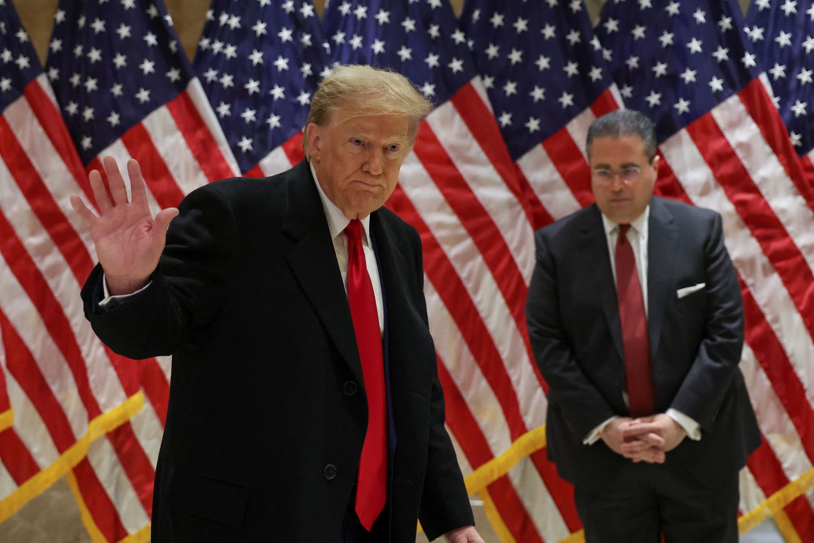 Republican presidential candidate and former U.S. President Donald Trump gestures at a press conference at one of his properties after attending a hearing in his criminal court case on charges stemming from hush money paid to a porn star in New York City, U.S., March 25, 2024. 