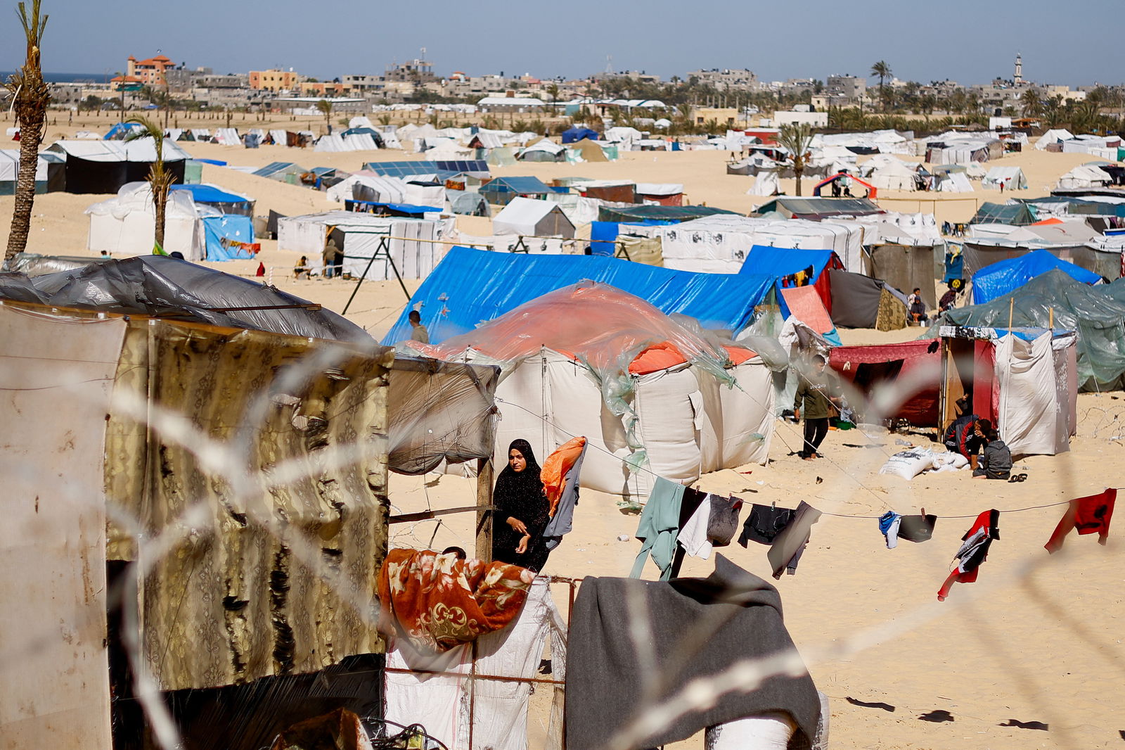 Displaced Palestinians, who fled their houses due to Israeli strikes, shelter at a tent camp, amid the ongoing conflict between Israel and the Palestinian Islamist group Hamas, in Rafah in the southern Gaza Strip, February 29, 2024. 