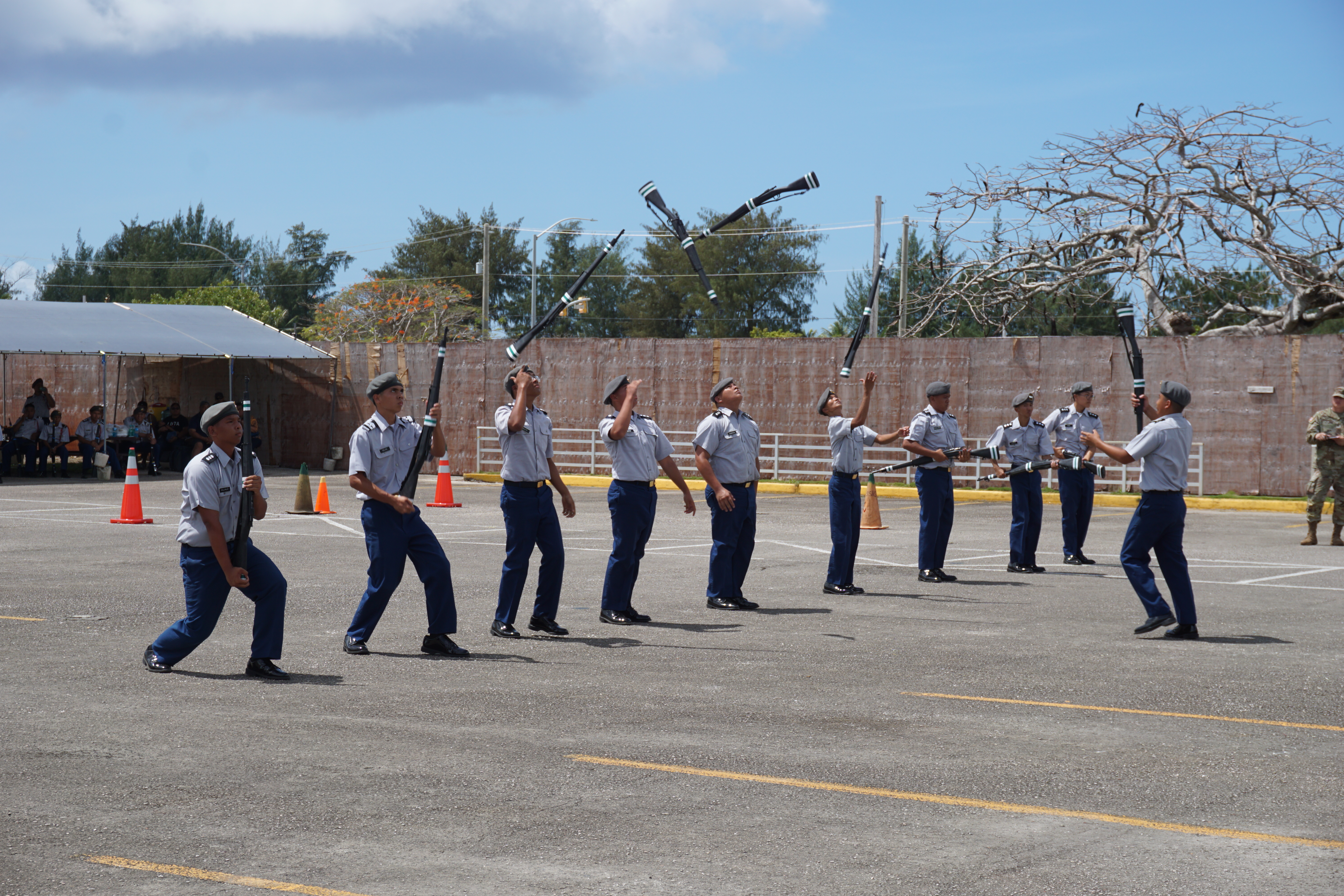 CNMI JROTC cadets toss their rifles in the air during competition at the recently ​concluded drill competition held on March 2.