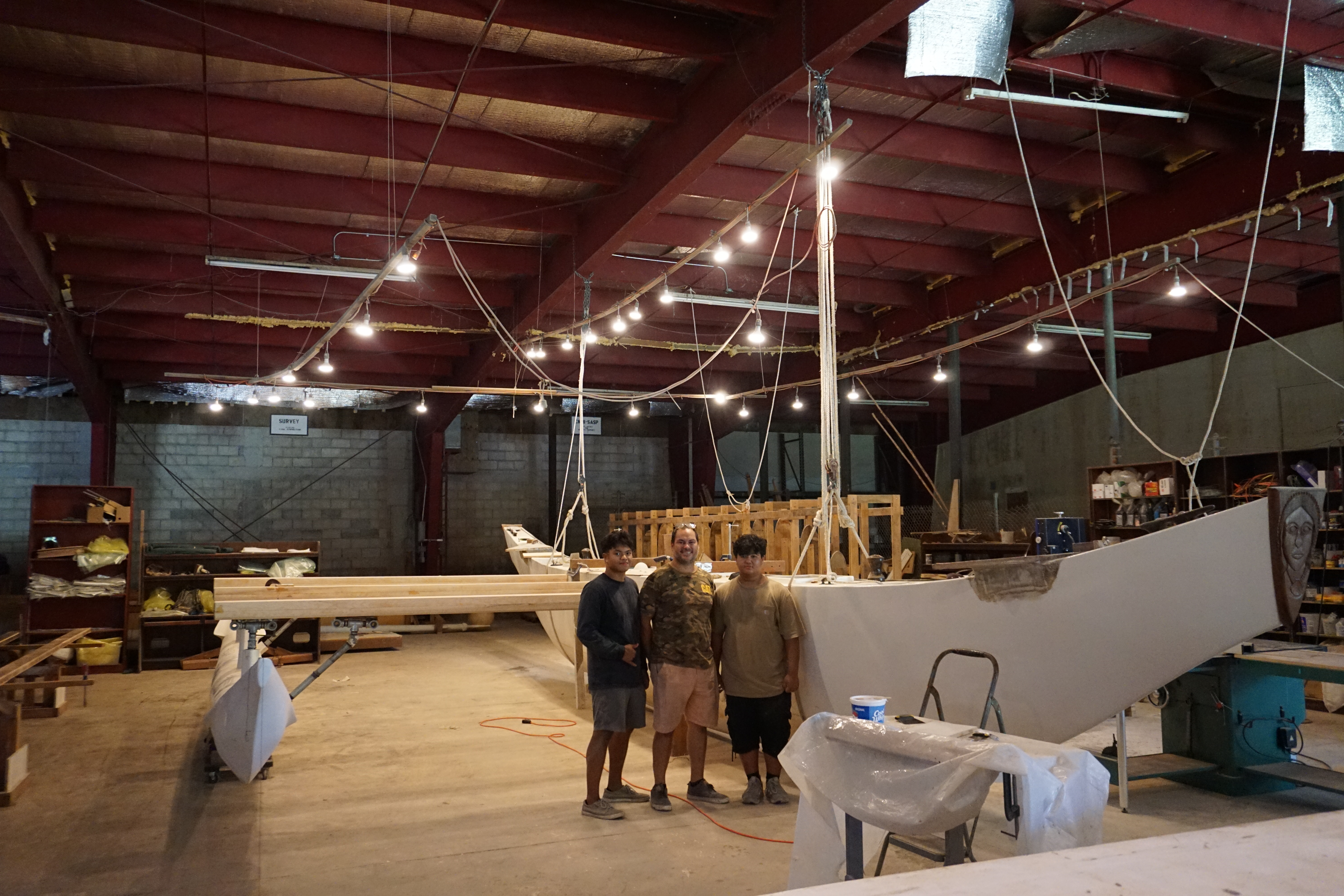 Standing by Ladahao, from left, Keith Quintanilla Jr., Keith Quintanilla Sr., and Zion Quintanilla.