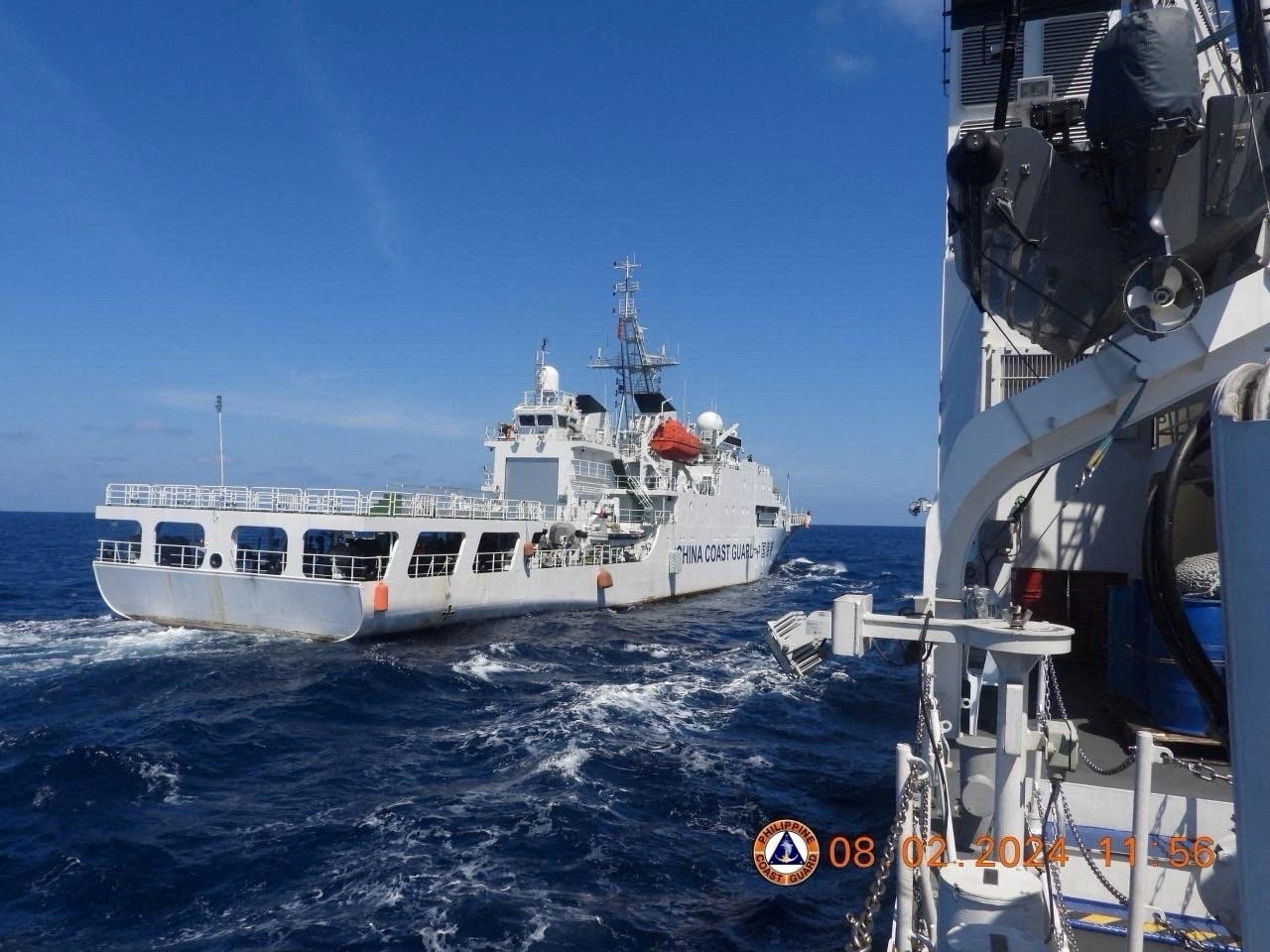 FILE PHOTO: A China Coast Guard vessel manoeuvres near Philippine Coast Guard vessel BRP Teresa Magbanua near Scarborough Shoal in the South China Sea, Philippines, February 8, 2024. 