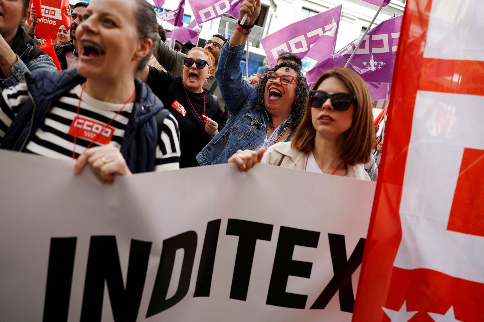 People take part in a protest in front of a Bershka store, demanding better benefits for workers after the company posted a record profit, in Madrid, Spain, March 22, 2024.
