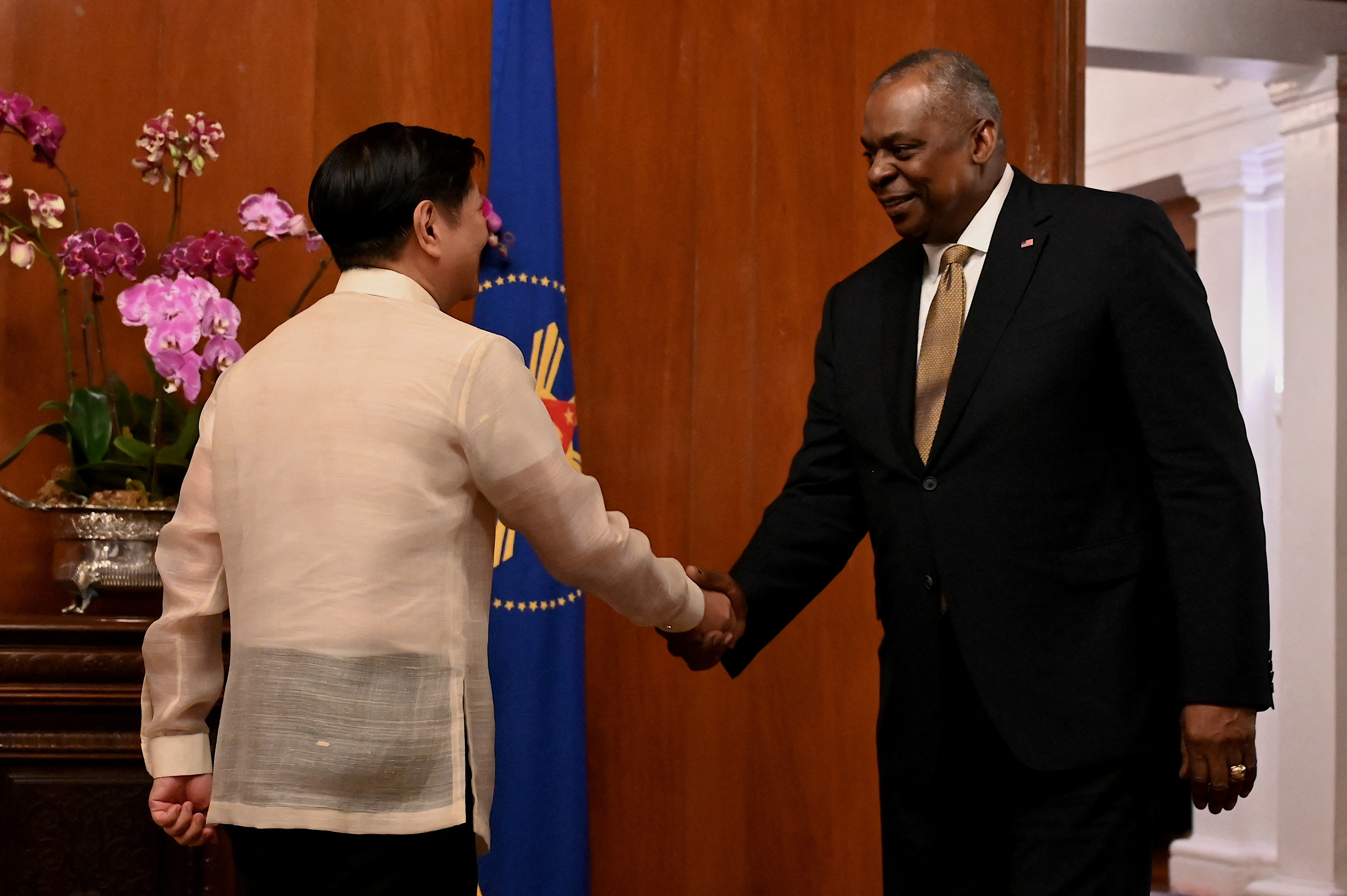 U.S. Defense Secretary Lloyd Austin III shakes hands with Philippines President Ferdinand "Bongbong" Marcos Jr. at the Malacanang presidential palace in Manila, Philippines, February 2, 2023. 