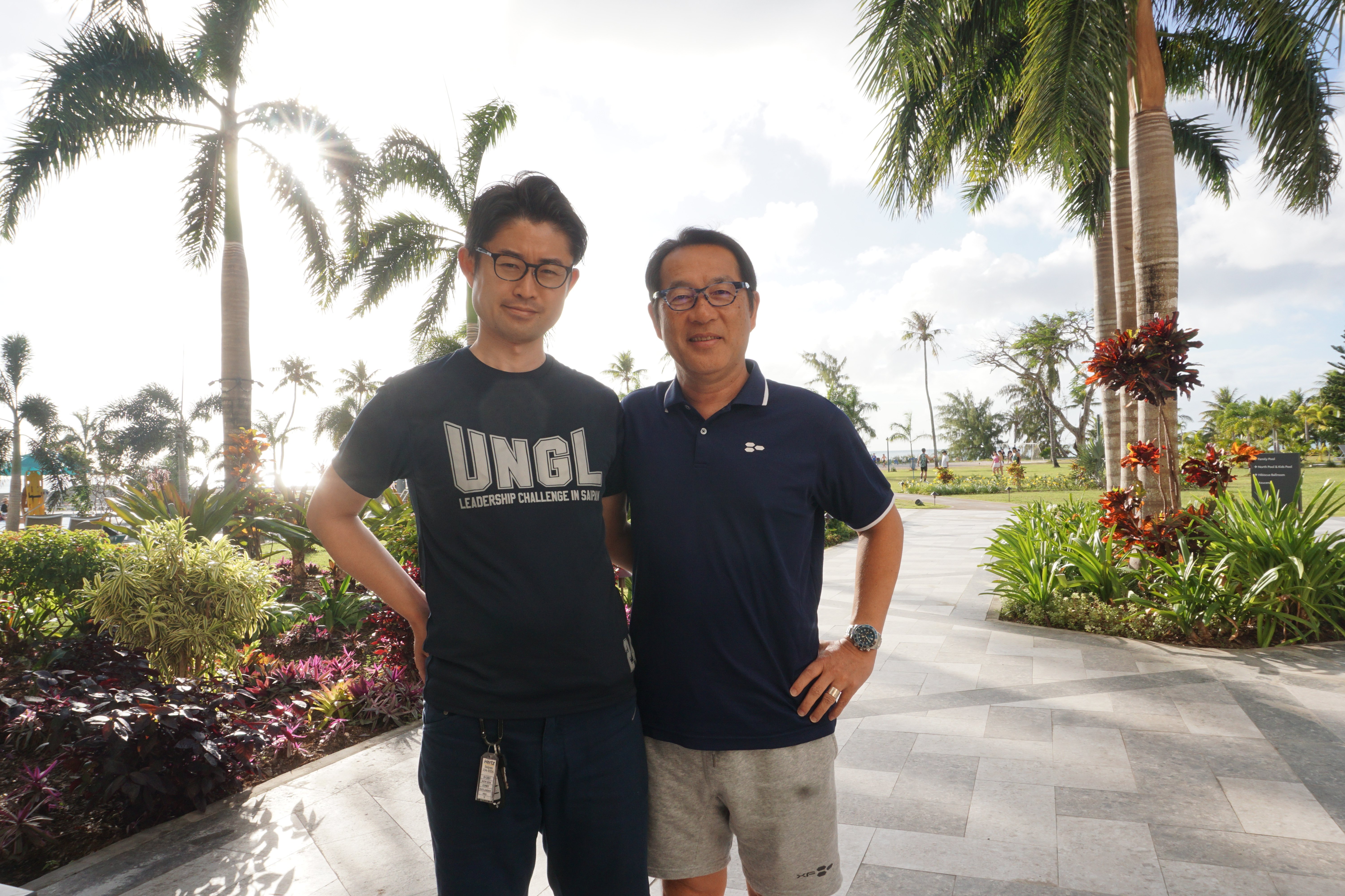 Kyushu International University Associate Professor Shinya Kawawaki, Ph.D., and Okayama University of Science Vice President Keiji Hata, Ph.D. pose for a photo at the Crowne Plaza Resort Saipan a day before competing in the Saipan Marathon on Saturday, March 9, 2024.