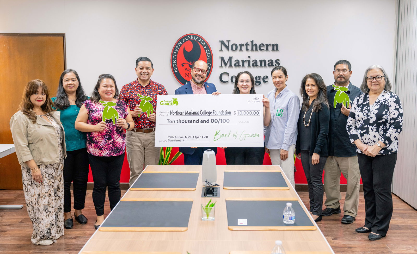 Bank of Guam donated $10,000 to the Northern Marianas College Foundation, in support of its upcoming Golf Open on March 23 and 24, 2024. In photo with NMC President Galvin Deleon Guerrero, EdD are BOG Executive Vice President/Chief Operating Officer Maria Eugenia H. Leon Guerrero, BOG Senior Vice President/Chief Retail & Card Services Manager Janice Chargualaf, BOG Senior Vice President/Chief Experience Officer Lesley-Ann Leon Guerrero, BOG's Kal Rengiil, BOG Vice President/CNMI Regional Manager Marcie M. Tomokane, NMC Vice President for Administration and Advancement Frankie Eliptico, NMC Dean of Student Support Services Charlotte Cepeda, NMC Director of the Office of Institutional Effectiveness Vilma Reyes, and NMC Human Resources Director Polly Masga.