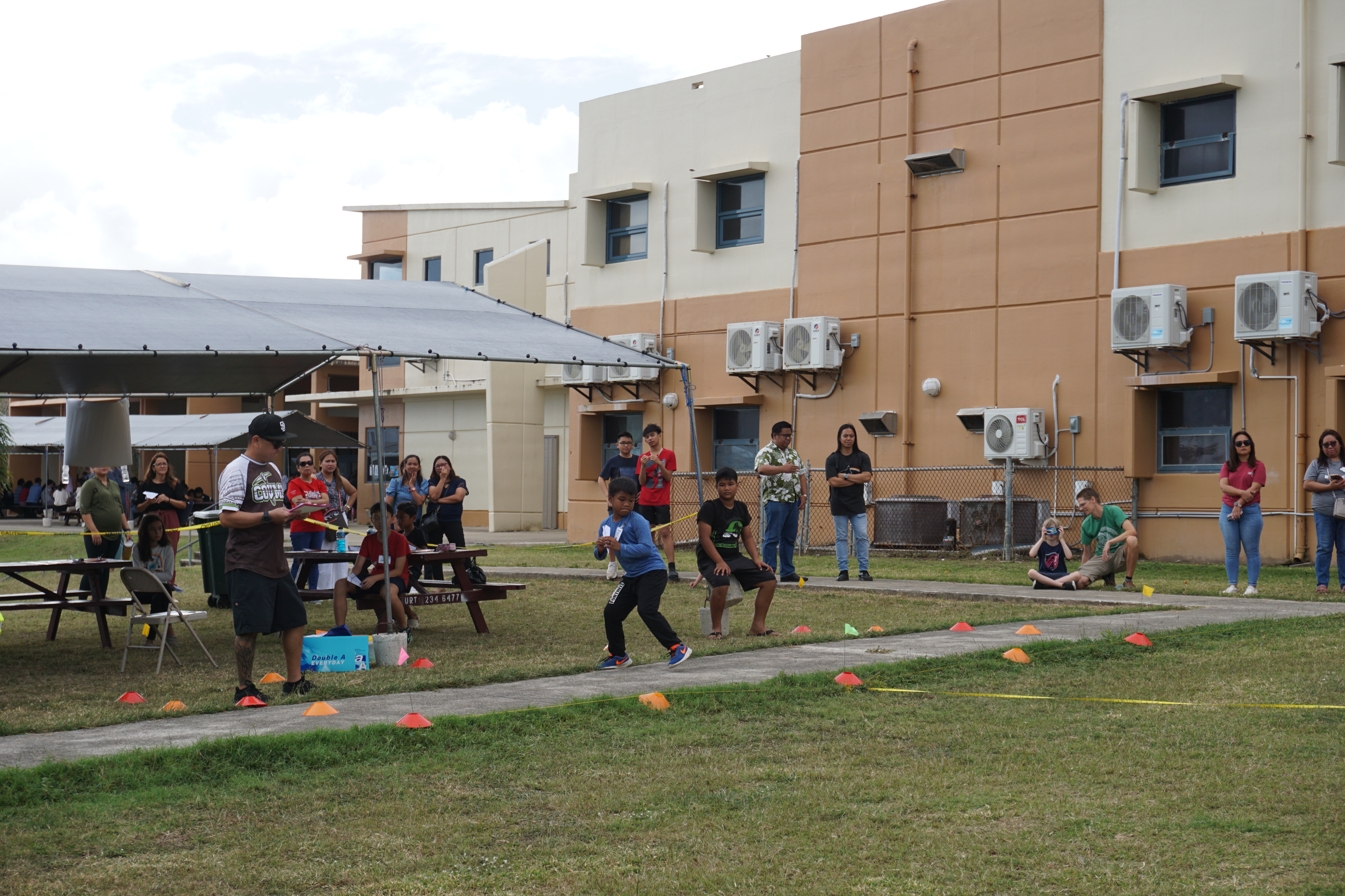 Garapan Elementary School student Seandrey Mendiola threw his plane 84 feet, six inches to take first place.