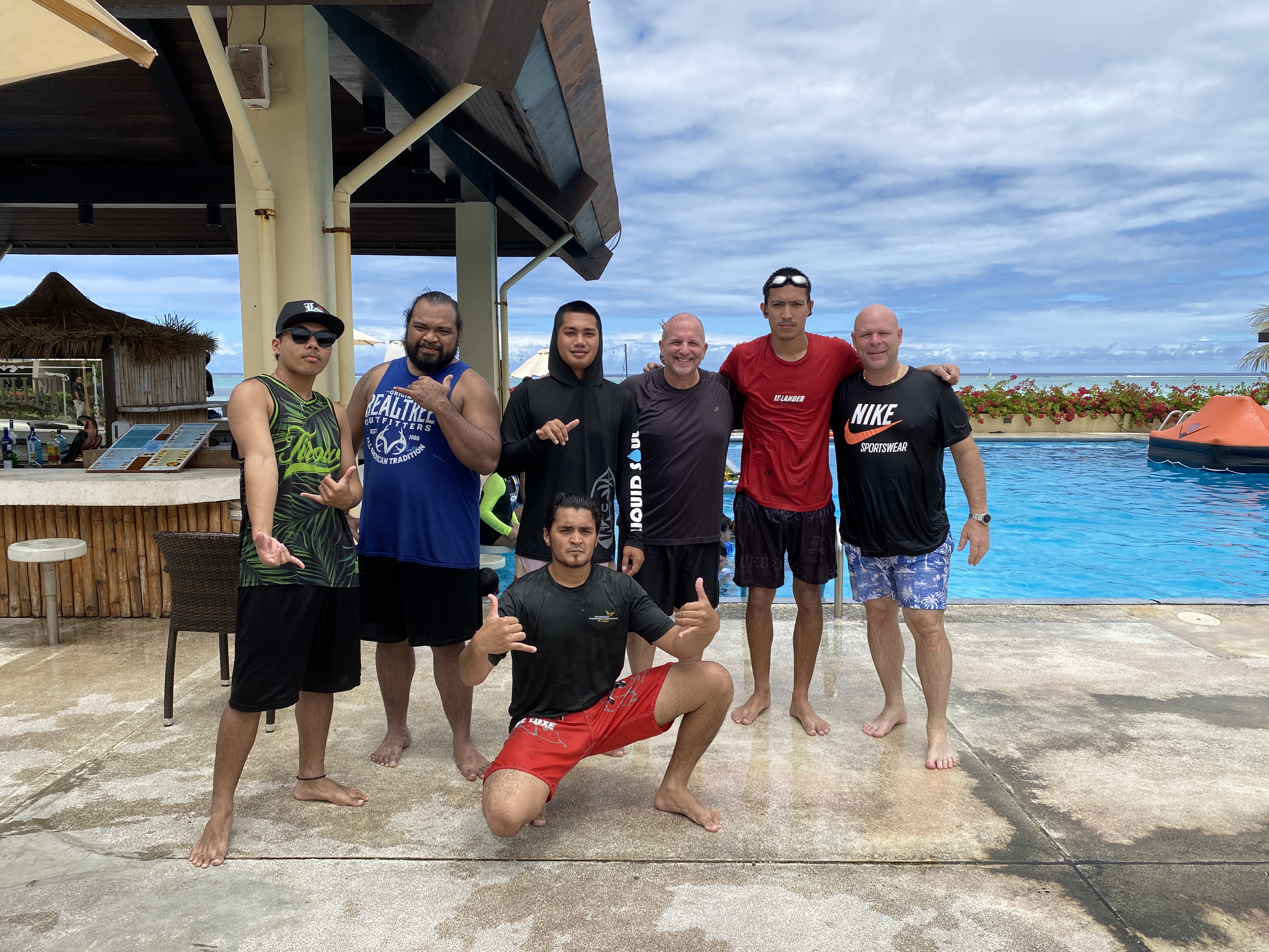 Western Pacific Maritime Academy students Robert Smith, front row; back row, Schneider Lanzo, second left, Christian Alepuyo, third  left, and David Meyers, fifth left at the Aqua Resort Club swimming pool where they are undergoing training on Wednesday, March 27. 