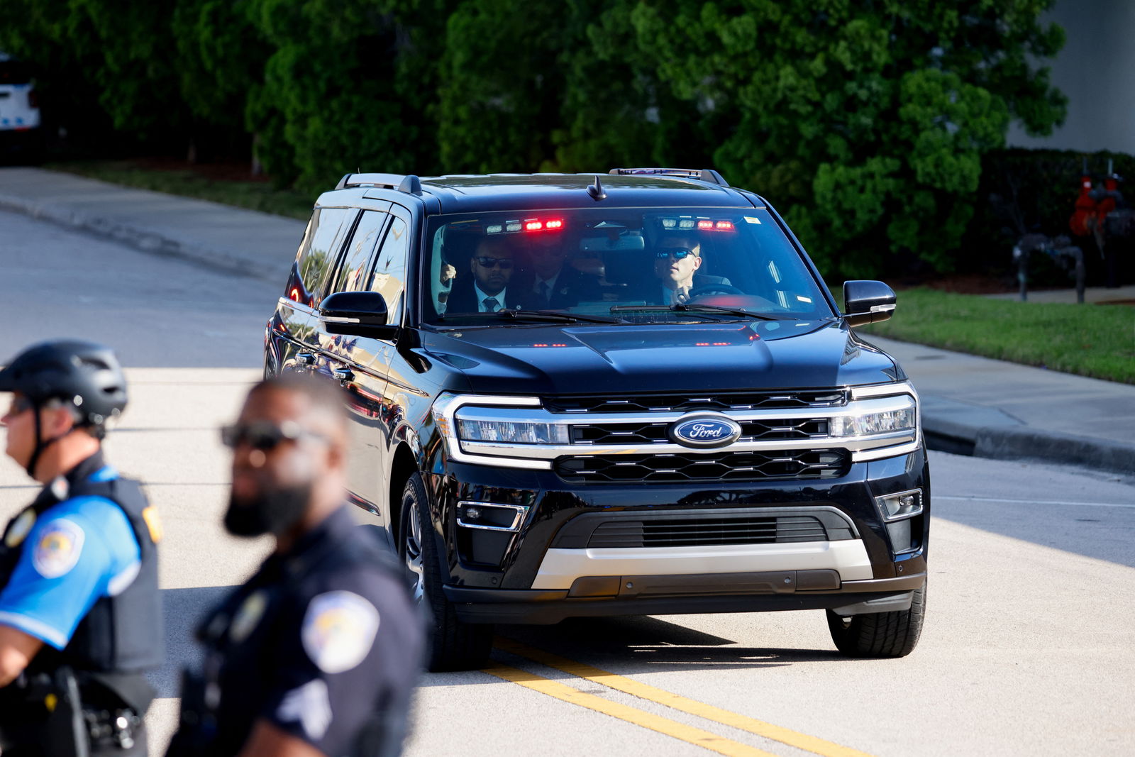 A vehicle of the motorcade of Republican presidential candidate and former U.S. President Donald Trump drives as Trump arrives at the courthouse as he is expected to bid for dismissal in a hearing on a classified documents case, in Fort Pierce, Florida, U.S. March 14, 2024. 
