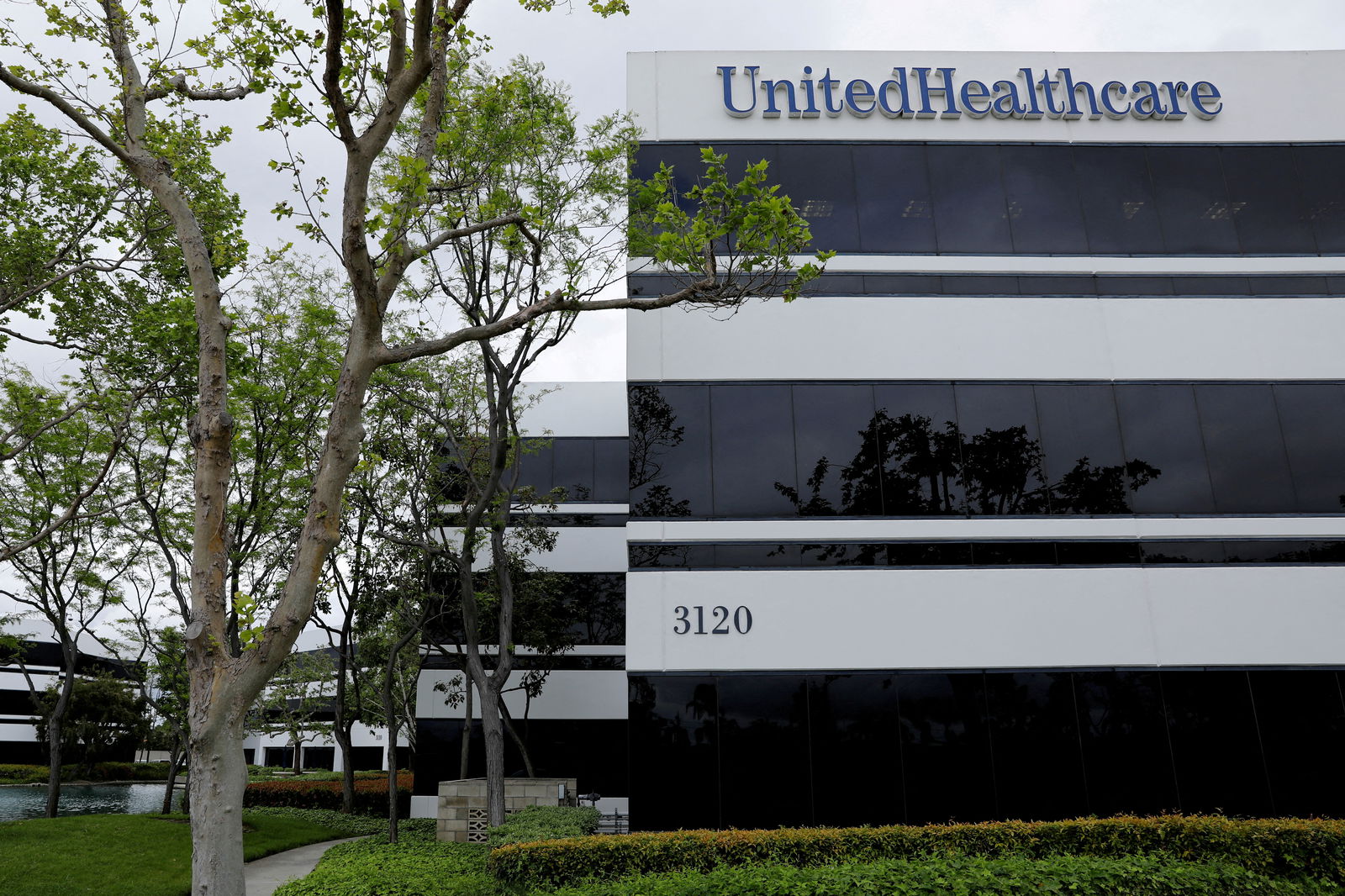 FILE PHOTO: The corporate logo of the UnitedHealth Group appears on the side of one of their office buildings in Santa Ana, California, U.S., April 13, 2020. 