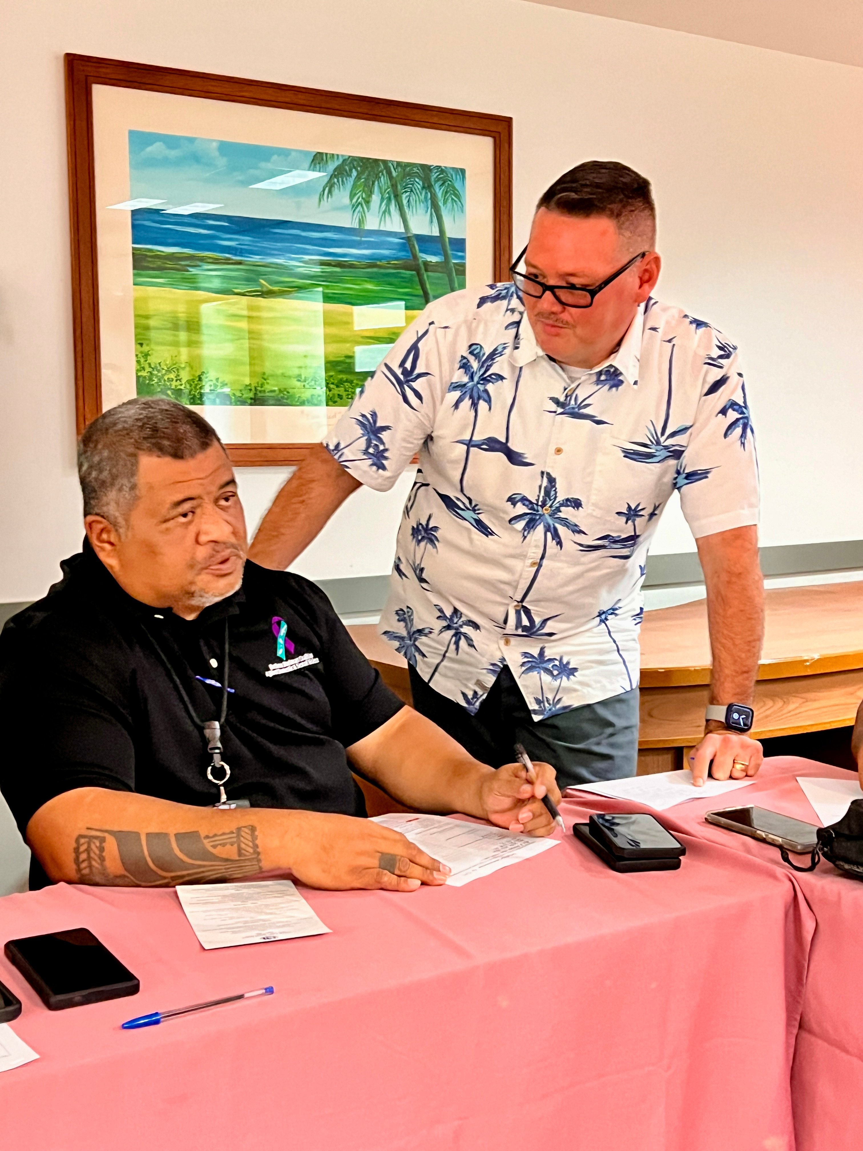 Garapan Elementary School Principal Derwin Johnson, right, with DPS Public Information Officer Fred Sato.