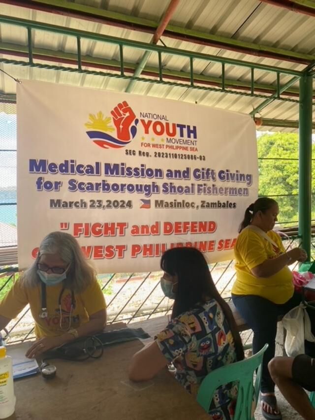 During NYMWPS’ medical mission, Dr. Celia Lamkin provided medical services to 100 individuals. Cherry Naluz, right, checks the blood sugar of a patient.