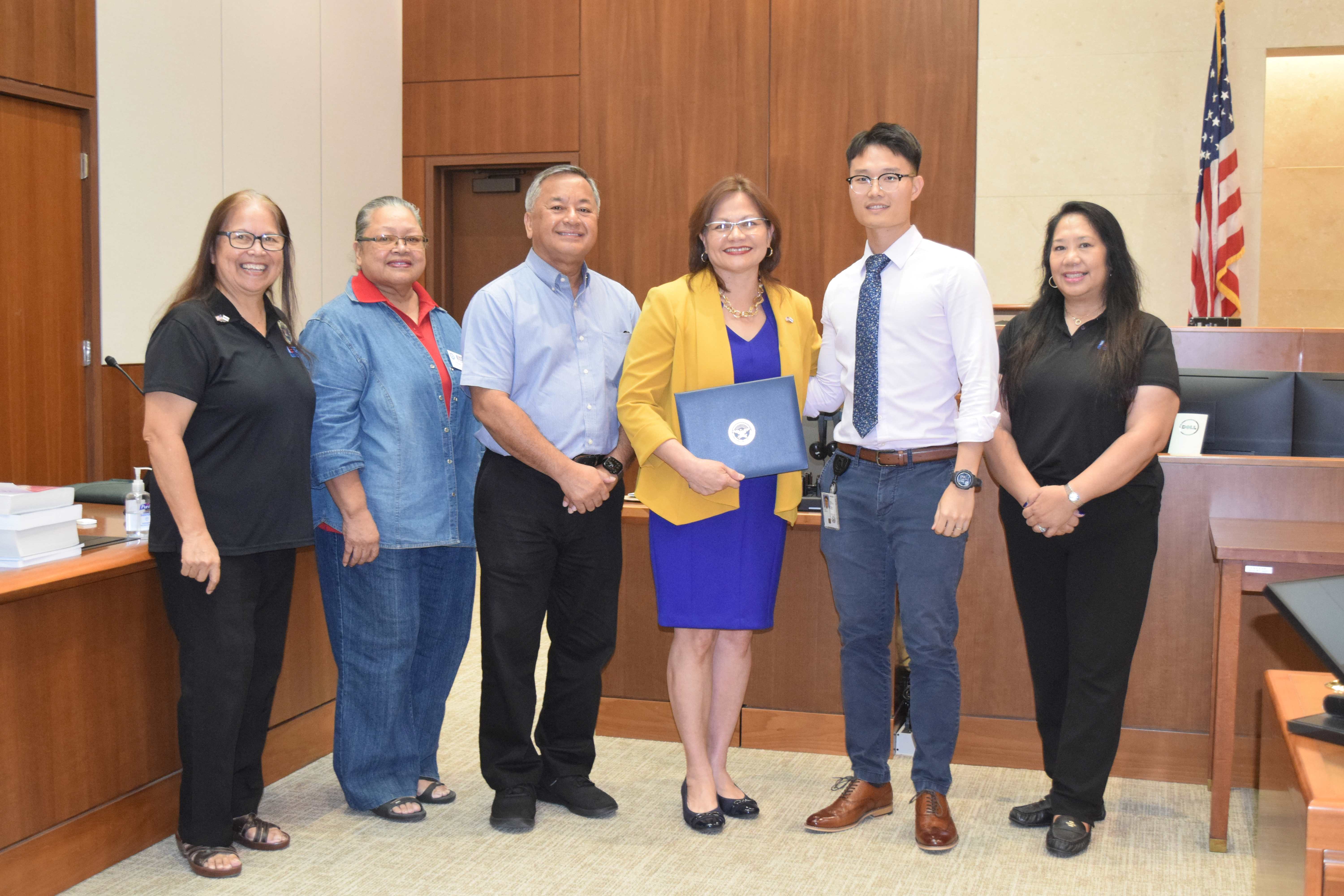 District Court for NMI Chief Judge Ramona V. Manglona, third right, and U.S. Air Force Reserve Senior Airman Justin Xu Poon, second right, with Employer Support for the Guard and Reserve Guam-CNMI Area Chair Rita A. Sablan, Ed.D., left, Civilian Aide to the U.S. Secretary of Army Mike Sablan, third left, ESGR Ombudsman Joann Aquino, right, and Employer Outreach Coordinator Rose Igitol, second left.