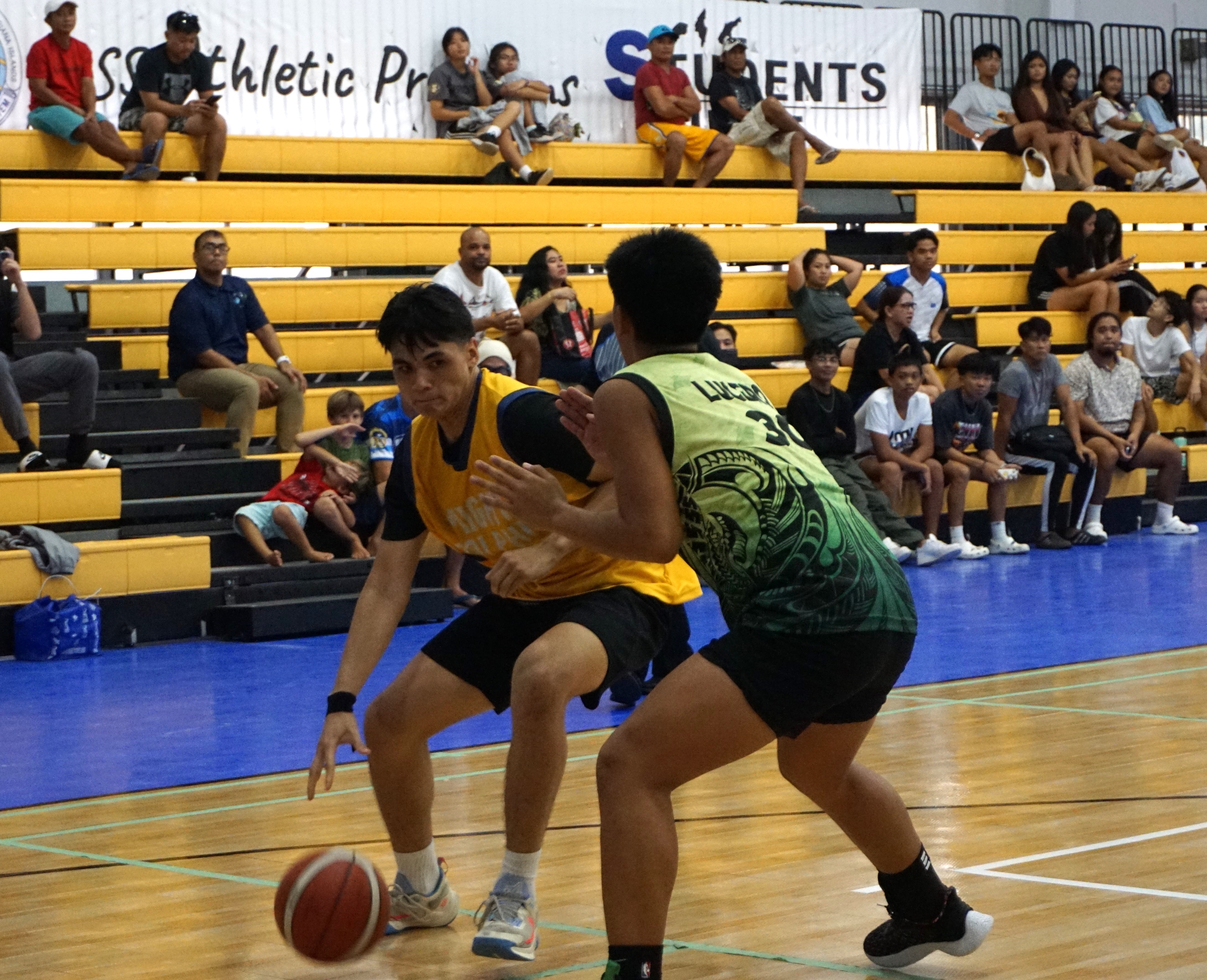 MHS' Charlz Sanchez posts up against an SSHS defender during the boys high school division championship game of the IT&E Interscholastic Basketball League SY23-24 at the Ada gym on Saturday.