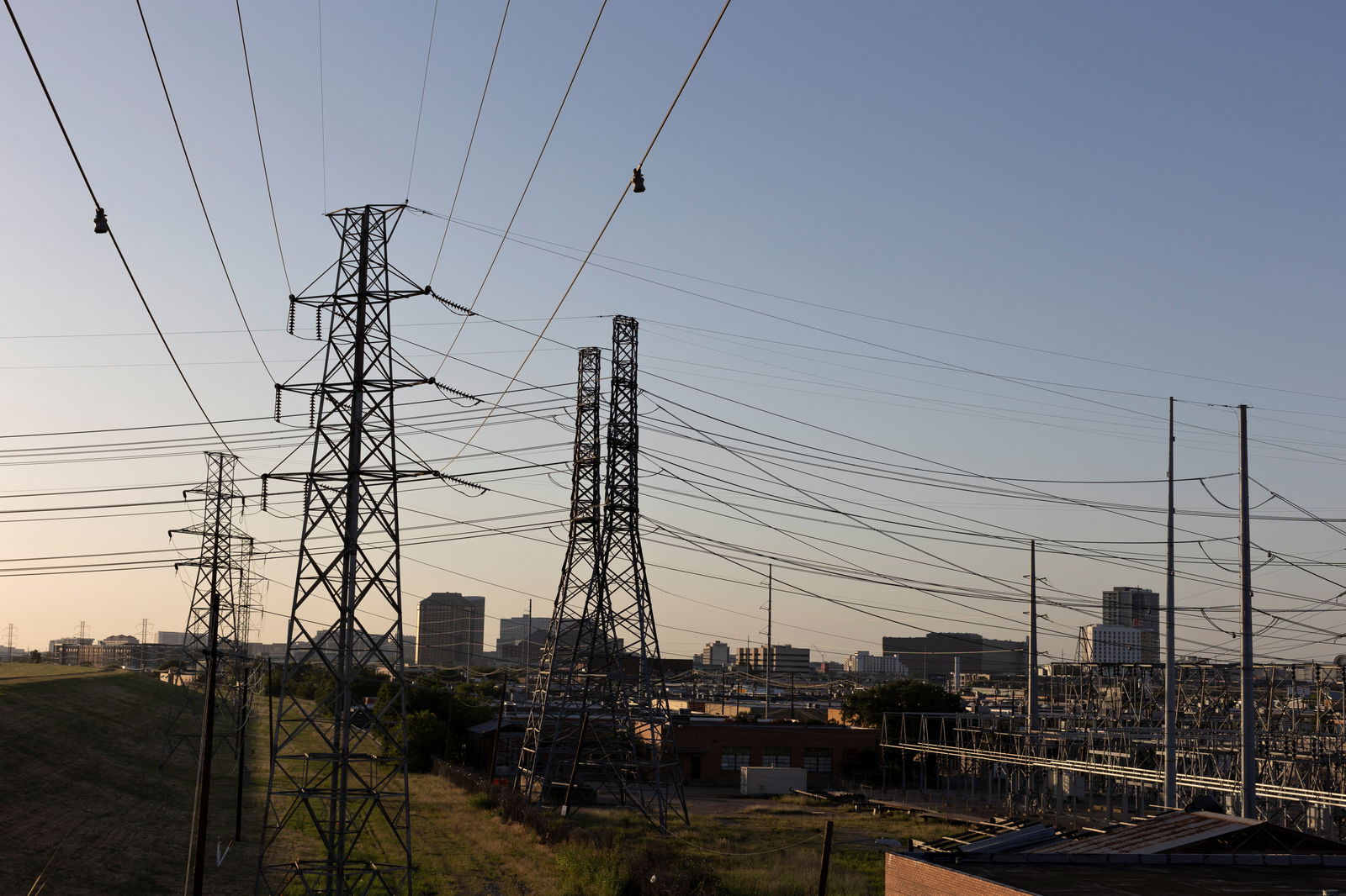 FILE PHOTO: Power lines are seen during a heatwave with expected temperatures of 102 F (39 C) in Dallas, Texas, U.S. June 12, 2022. 