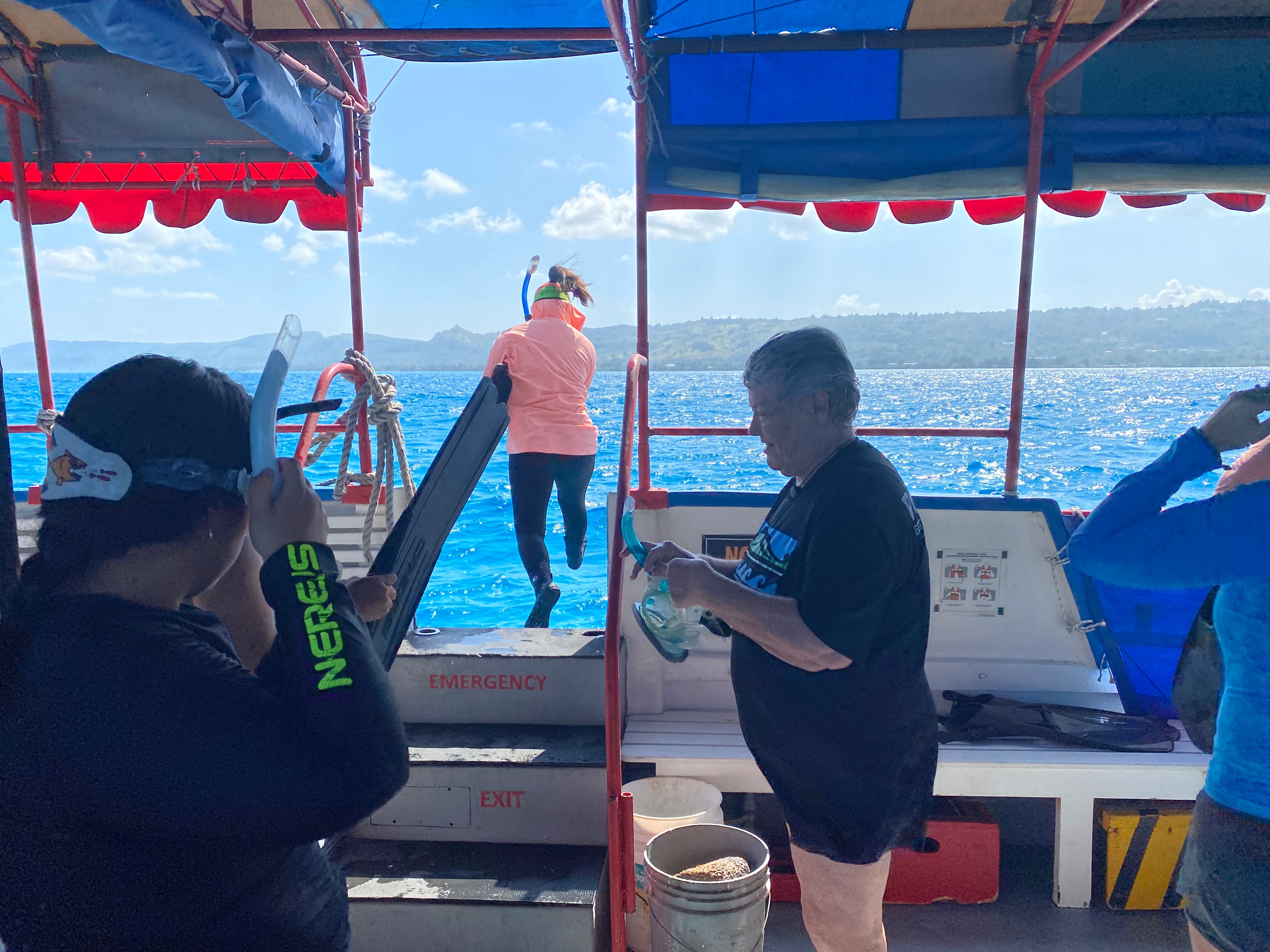 Kylie Hasegawa, a JAMS employee, leaps off the boat and into the Saipan Lagoon during a field trip to the Saipan Coral Nursery on Feb. 28.
