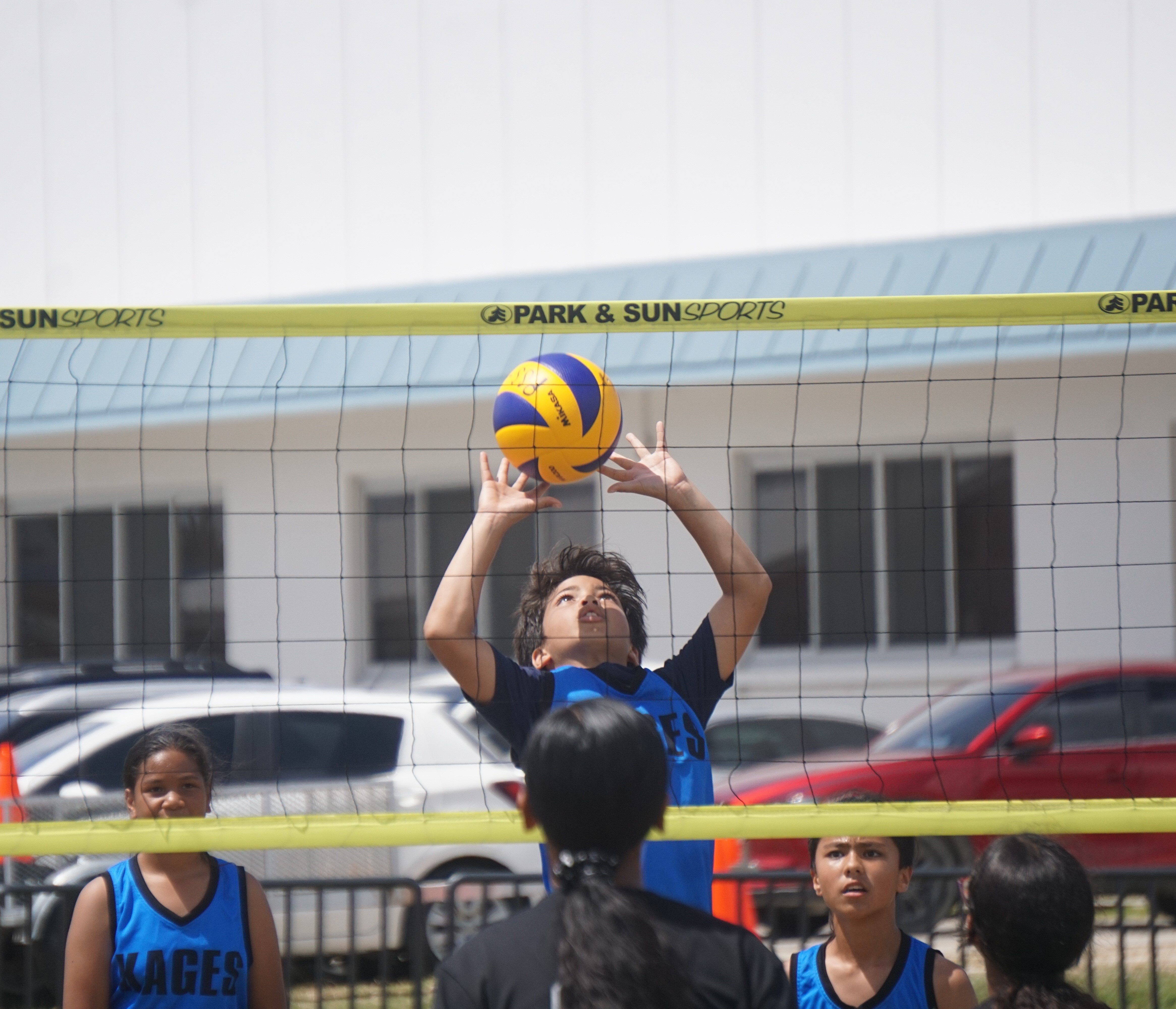 A Kagman Elementary School player sets up the ball during the championship game in the co-ed elementary school division of the NMIVA-PSS Interscholastic Volleyball League SY23-24 at the Oleai Sports Complex on Saturday.