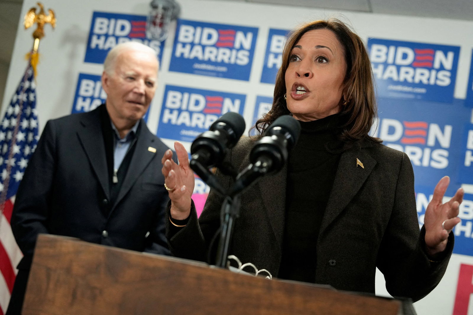 FILE PHOTO: Vice President Kamala Harris speaks next to U.S. President Joe Biden during the opening of the Biden for President campaign office in Wilmington, Delaware, U.S., February 3, 2024. 