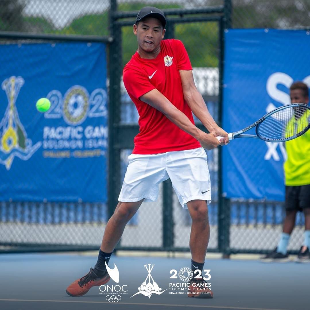 Tahiti’s Heimanarii Lai San gathers for the back hand return during a tennis match at the 2023 Pacific Games in the Solomon Islands.