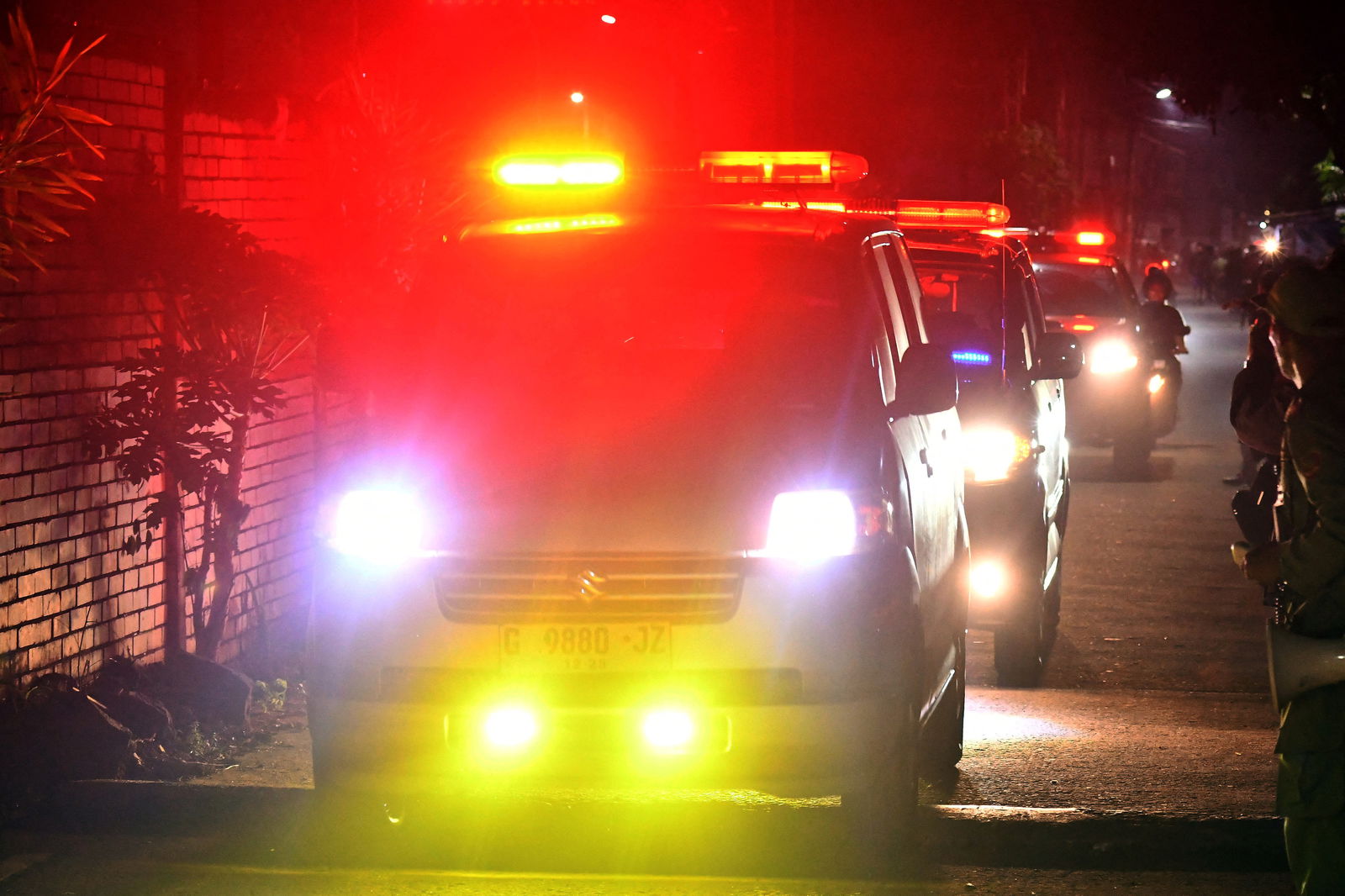 An ambulance stands by during a massive fire that broke out at a military ammunition facility in Bekasi, on the outskirts of Jakarta, Indonesia, March 30, 2024, in this photo taken by Antara Foto.