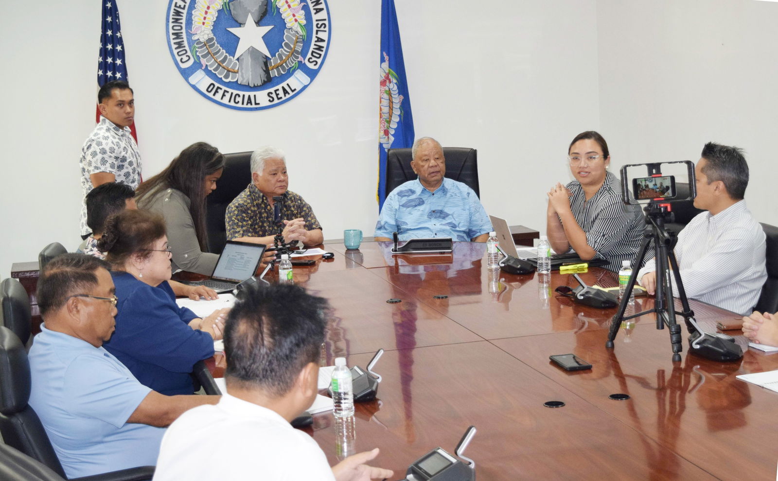 Finance Secretary Tracy B. Norita, second right, answers a question from the media as Gov. Arnold I. Palacios, fourth right, and Lt. Gov. David M. Apatang, third right, listen during a press conference on Capital Hill on Monday. Also in photo are Marianas Visitors Authority Managing Director Chris Concepcion, right, Department of Public Works Secretary Ray N. Yumul, third left, partly hidden, Office of Planning and Development Director and Capital Improvement Project Administrator Elizabeth Balajadia, second left, and DPW Highway Engineer Henry Bautista, left.