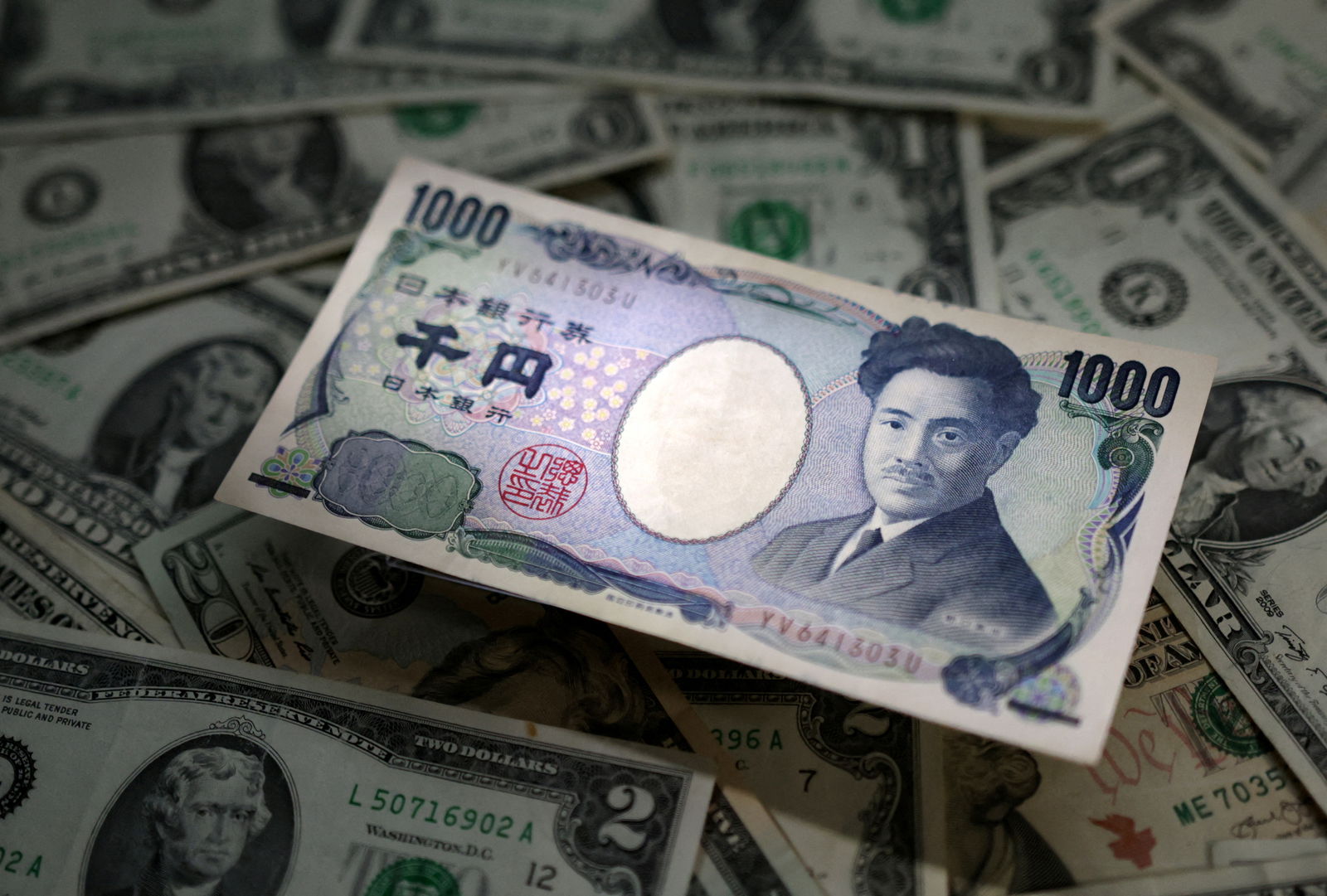 Japanese Yen and U.S. dollar banknotes are seen in this illustration taken March 10, 2023. 