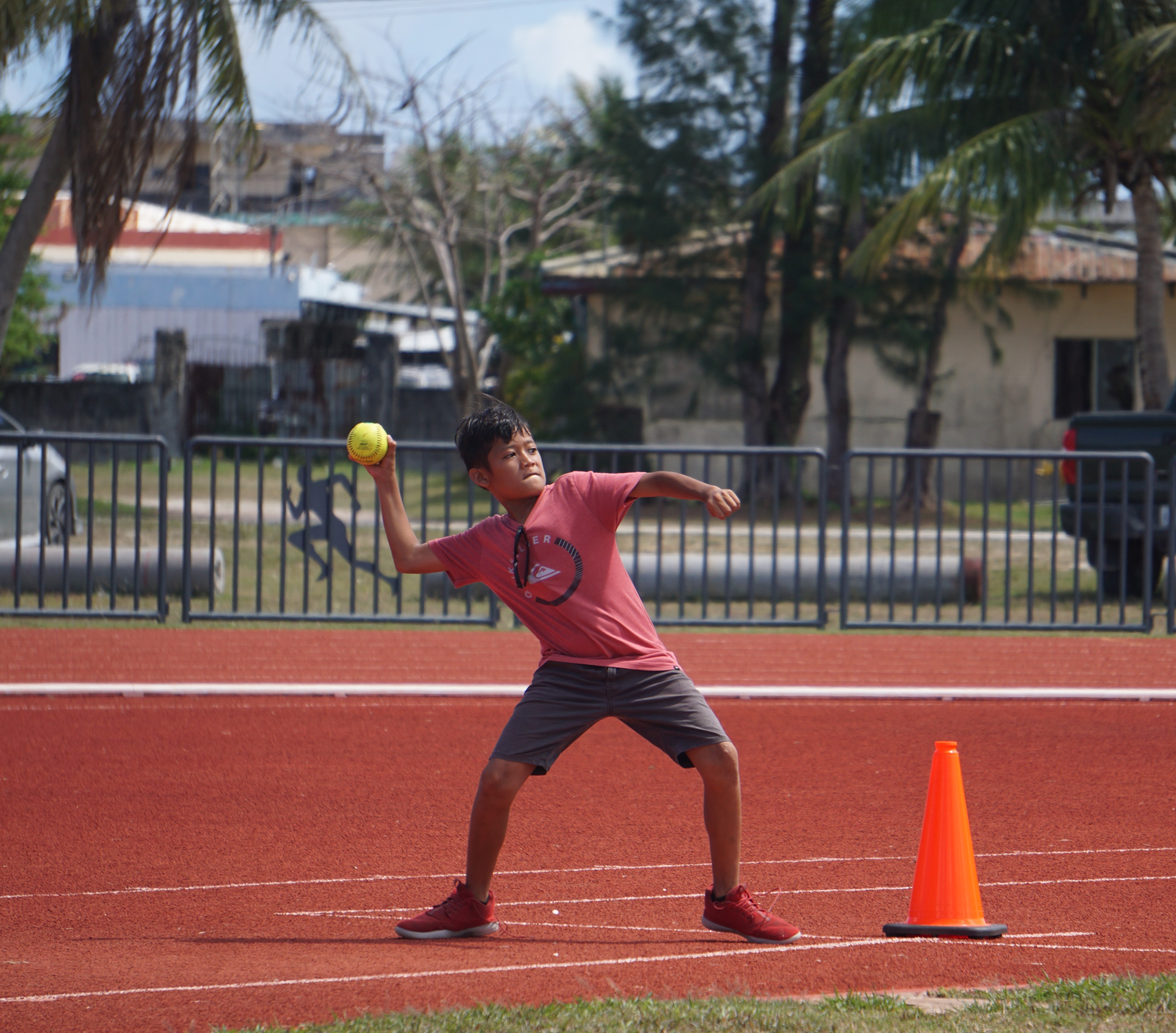 An elementary school athlete steps up for his attempt in the U12 boys’ softball throw event of the PSS-McDonald's All School Track & Field (Athletics) at the Oleai Sports Complex on Saturday.