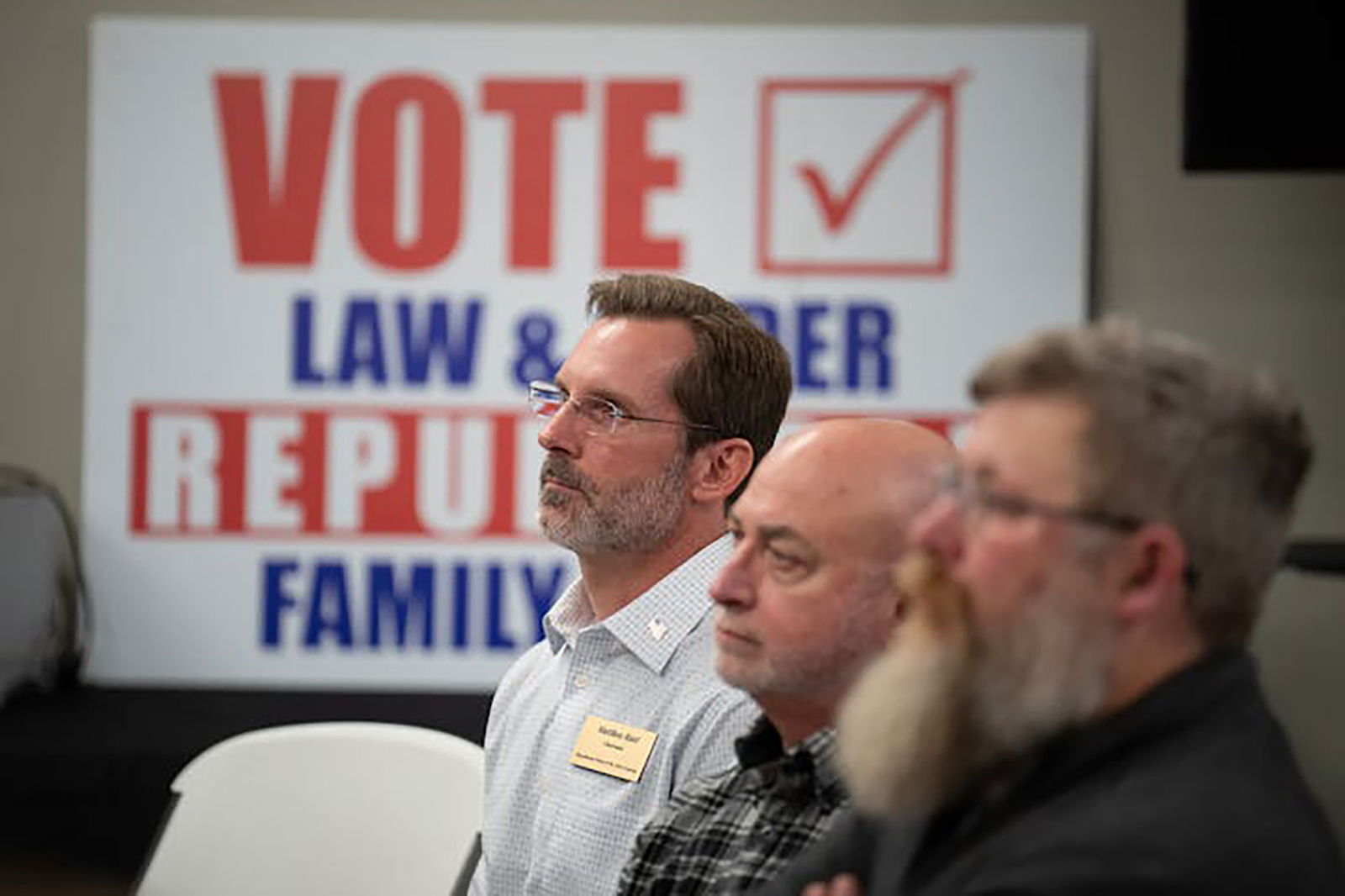 St. Croix County Republican Party Chair Matthew Rust, left, listens as the county sheriff and administrator make the case for supporting a ballot initiative that would fund public safety measures, during a session at the party's headquarters on March 28, 2024, in Hudson, Wisconsin. (Jeff Wheeler/Minneapolis Star Tribune/TNS)