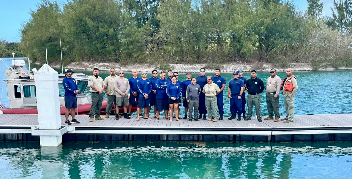 U.S. Coast Guard members from U.S. Coast Guard Forces Micronesia/Sector Guam take a moment for a photo with participants in a comprehensive subject matter expert exchange with multiple agencies in Tanapag, Saipan on April 12, 2024, to enhance inter-agency cooperation and proficiency in maritime operations. Local agencies included representatives from the CNMI Department of Fire and Emergency Medical Services, the CNMI Division of Fish and Wildlife and the Guam Department of Agriculture.