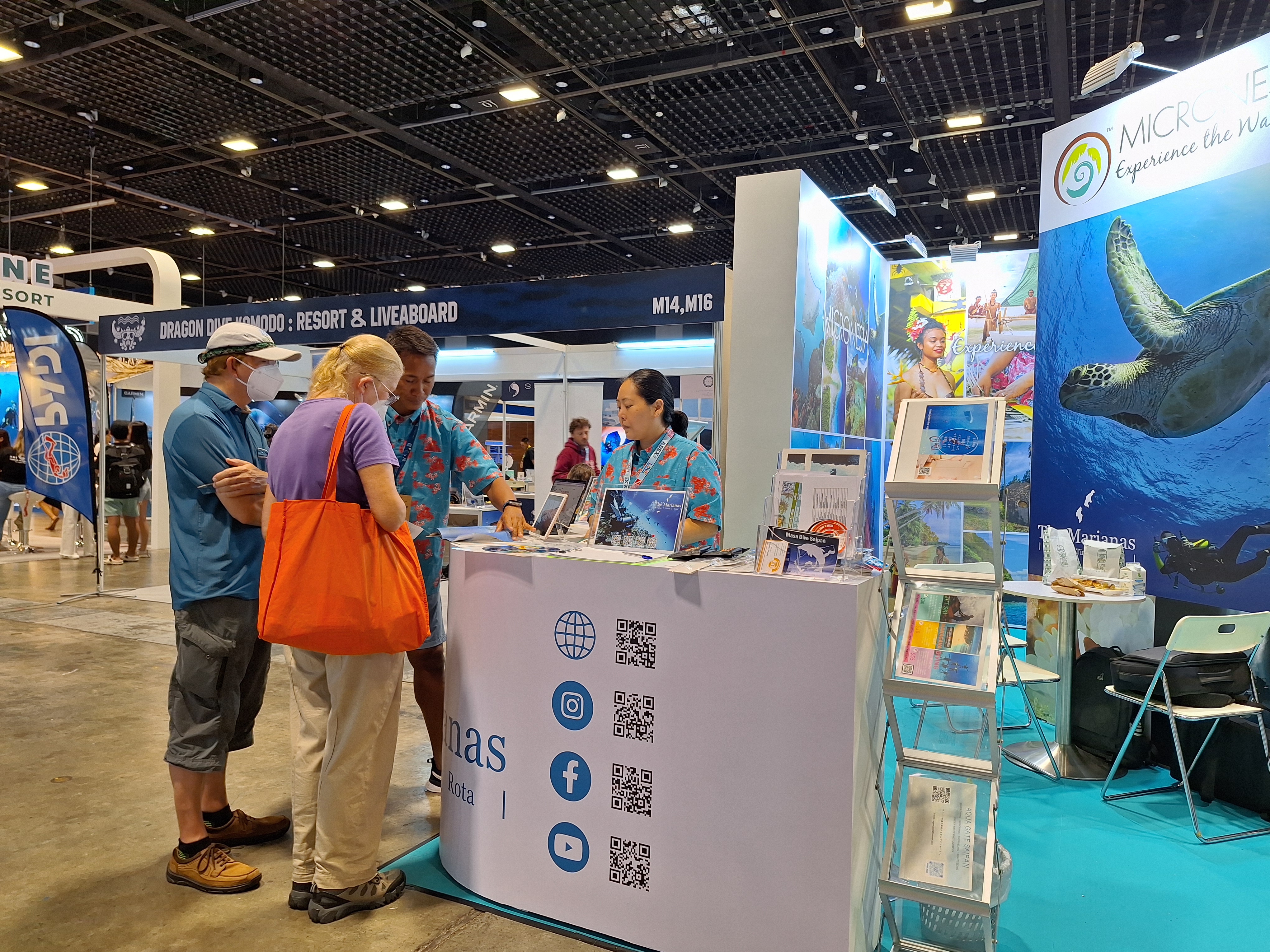 Diving enthusiasts stop by the Marianas Visitors Authority booth at ADEX Ocean Festival Singapore on April 12-14, 2024, to learn more about Marianas diving and other attractions.