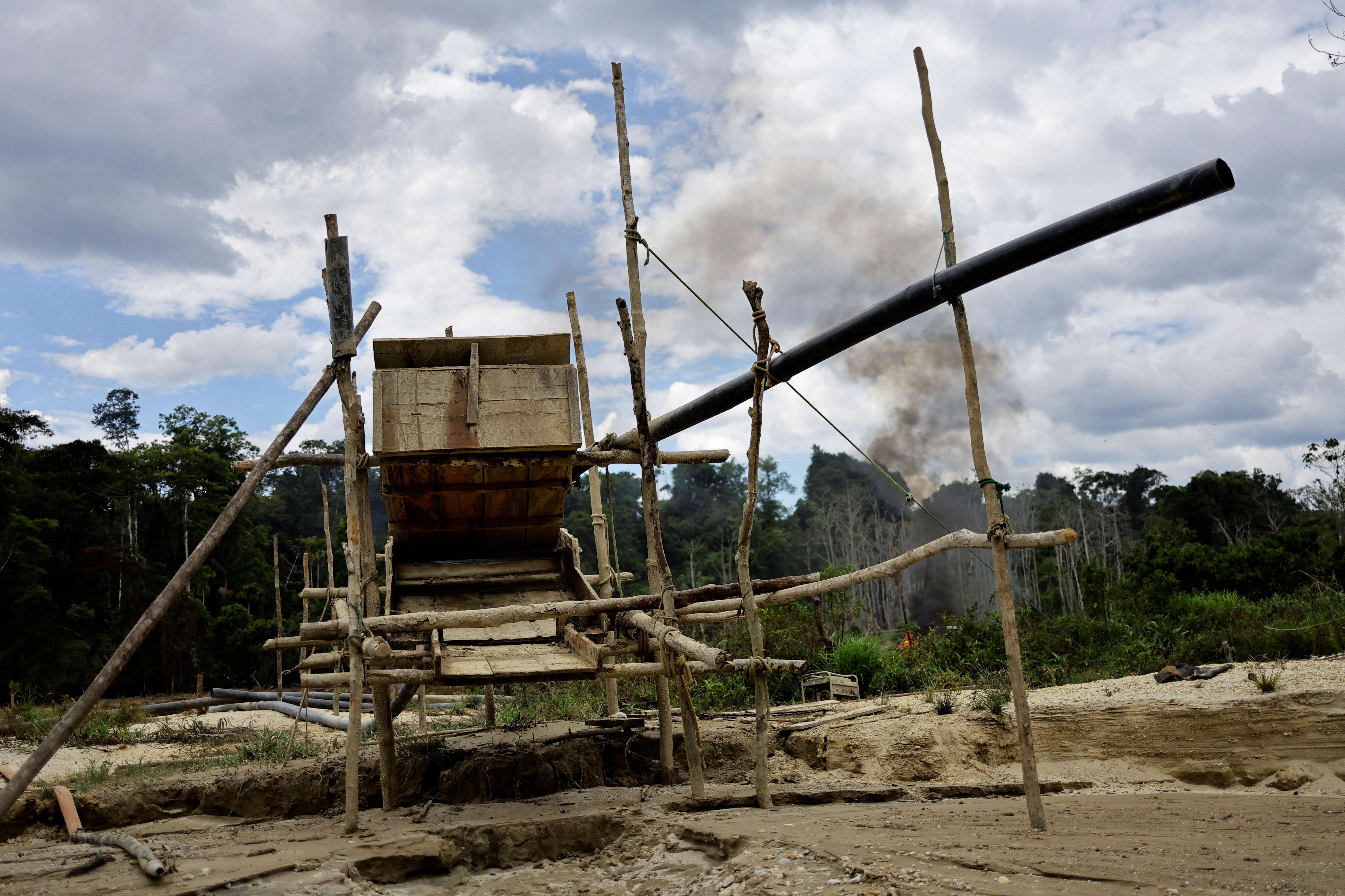 A structure to remove gold and cassiterite is pictured at the banks of Couto de Magalhaes river, during an operation by the Brazilian Institute of Environment and Renewable Natural Resources (IBAMA) against illegal mining in Yanomami Indigenous land, Roraima state, Brazil, December 6, 2023. 