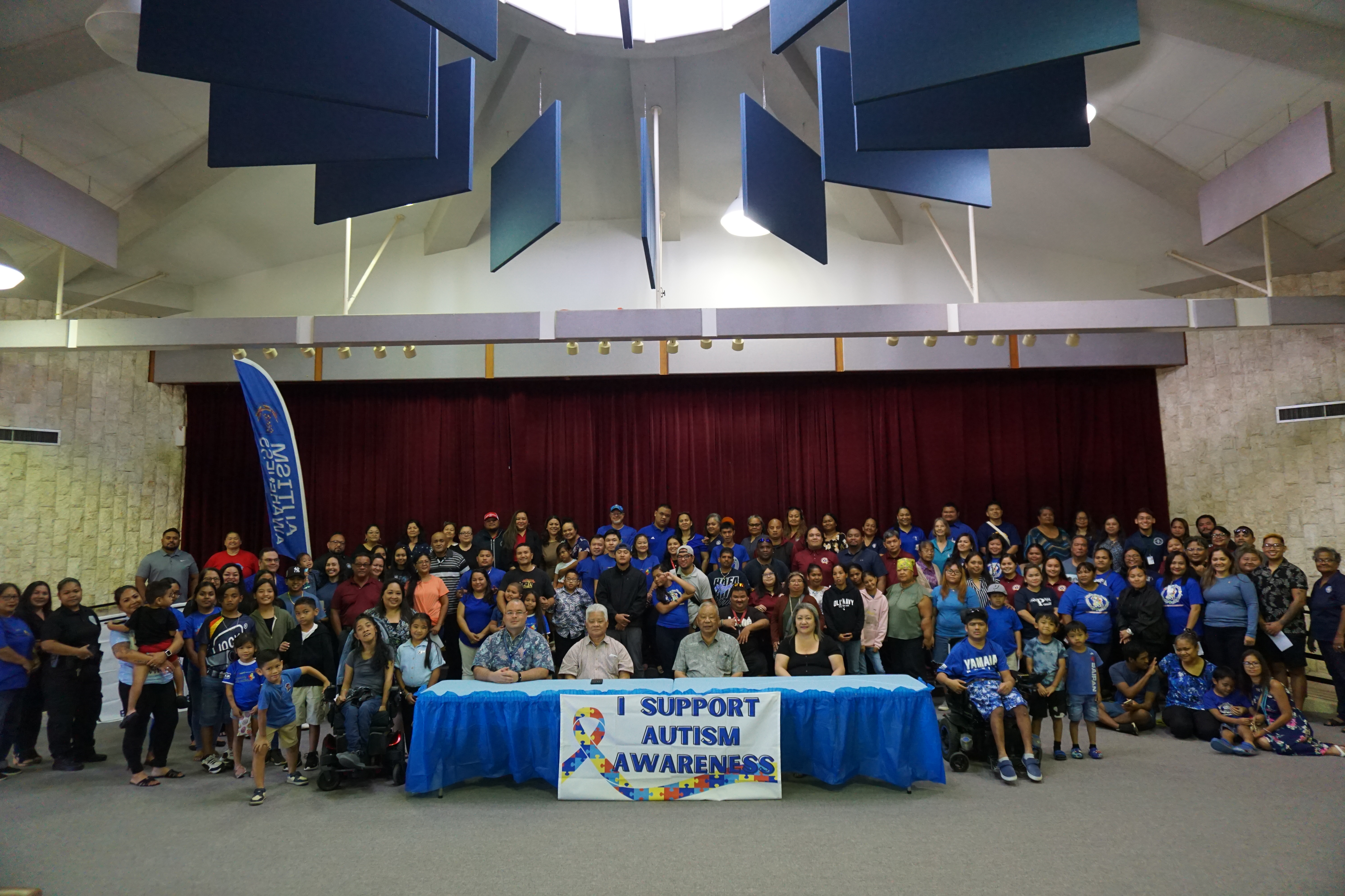 Gov. Arnold I. Palacios and Lt. Gov. David M. Apatang, with Senate President Edith Deleon Guerrero and House Speaker Edmund S. Villagomez, poses for a photo with educators, advocates and other community members after the signing of a proclamation designating April as Autism Awareness Month at the Gov. Pedro P. Tenorio Multi-Purpose Center on Monday, April 1. 