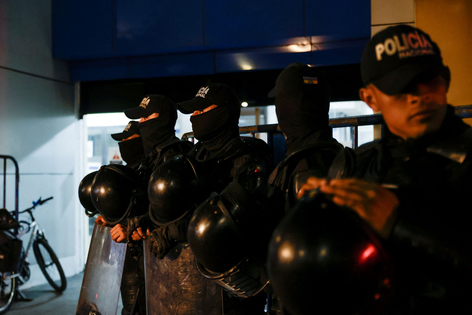 Police officers stand guard outside the Flagrancy Unit, where former Ecuador Vice President Jorge Glas is believed to be detained, in Quito, Ecuador April 5, 2024. 