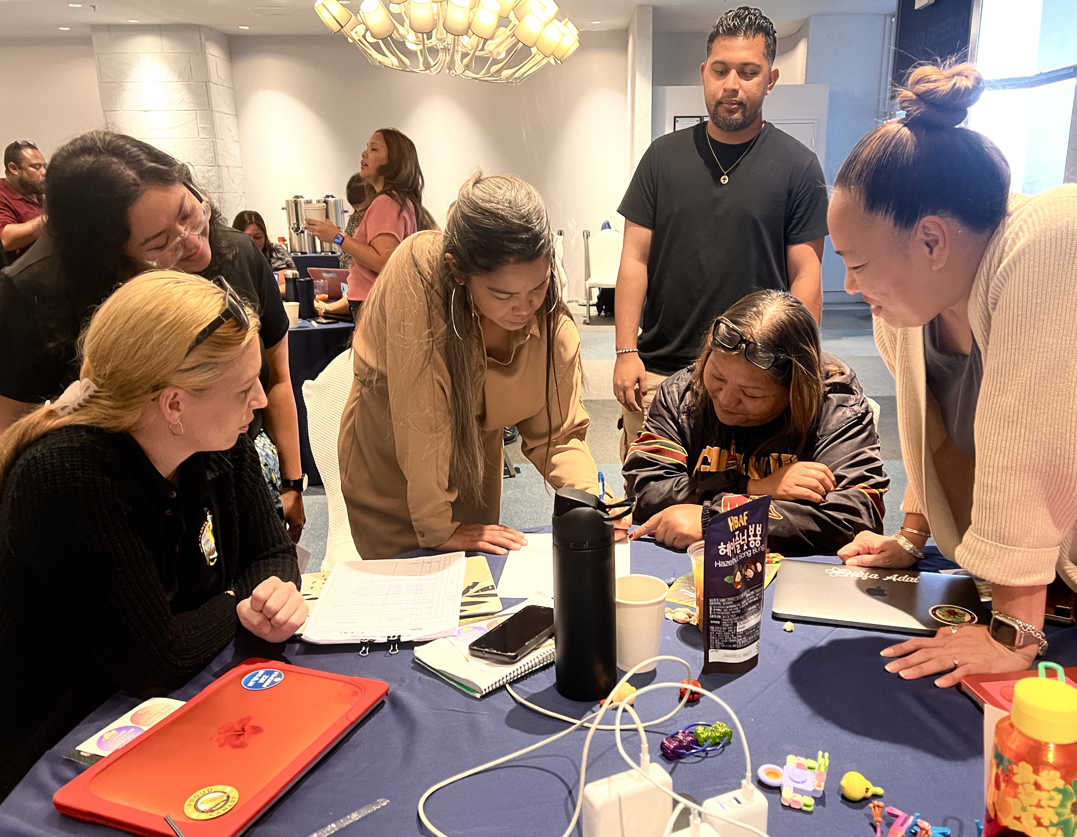 Vice Principals Ana Guerrero, Alisa Pangelinan, Francisca Bondoc and Arisa Sakai participate in a word game bingo activity.
