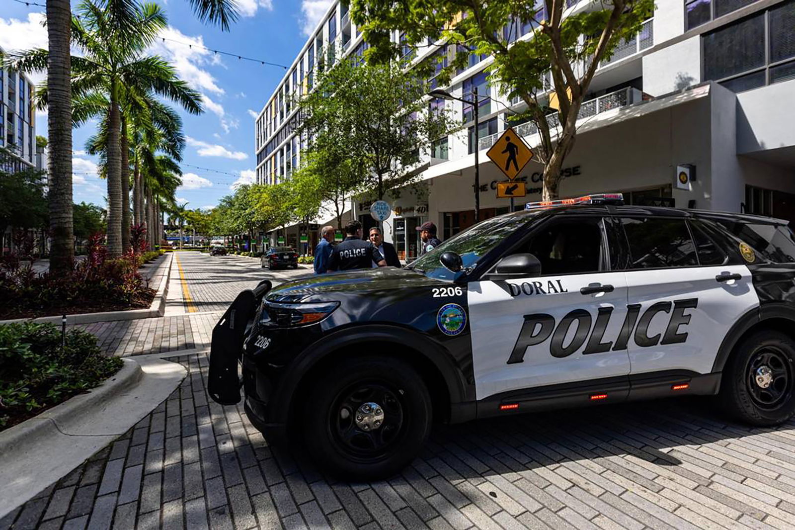 Police cruisers are stationed before the roundabout inside CityPlace Doral on Saturday, April 6, 2024, in Doral, Florida. A security guard and the gunman were shot dead, and seven others were injured, including an Army-trained Doral police officer who wrapped a tourniquet around his injured upper thigh, in a shootout involving police at a Doral nightclub early Saturday. (D.A. Varela/Miami Herald/TNS)