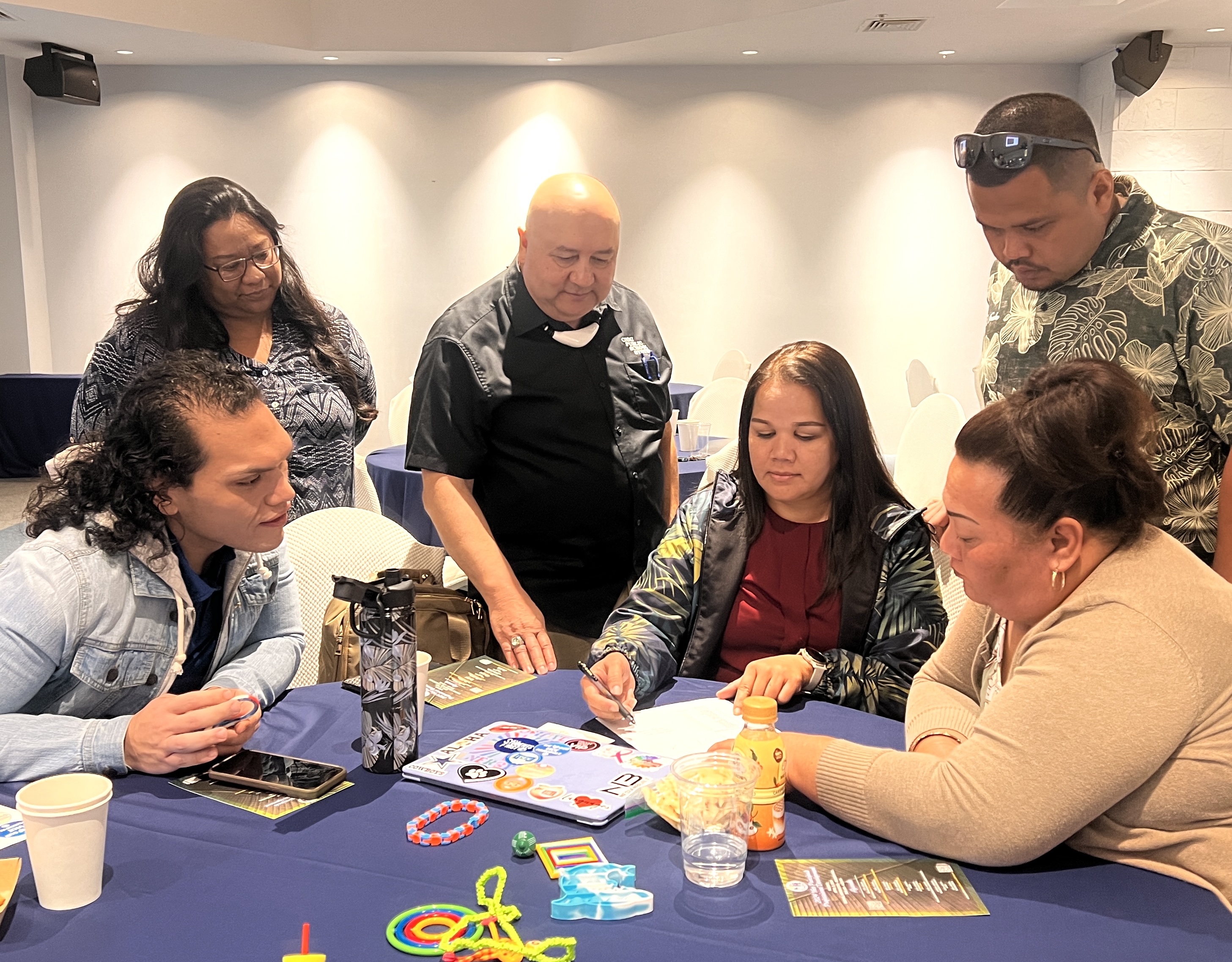 MHS Vice Principal Romolo Orsini, Information Technology and Distance Education Director Lorraine Catienza, Commissioner of Education Dr. Lawrence F. Camacho, Chacha Oceanview Middle School Vice Principal Carla Sablan and MHS Vice Principals Melanie S. Rdiall and Preston Basa participate in a professional development activity.