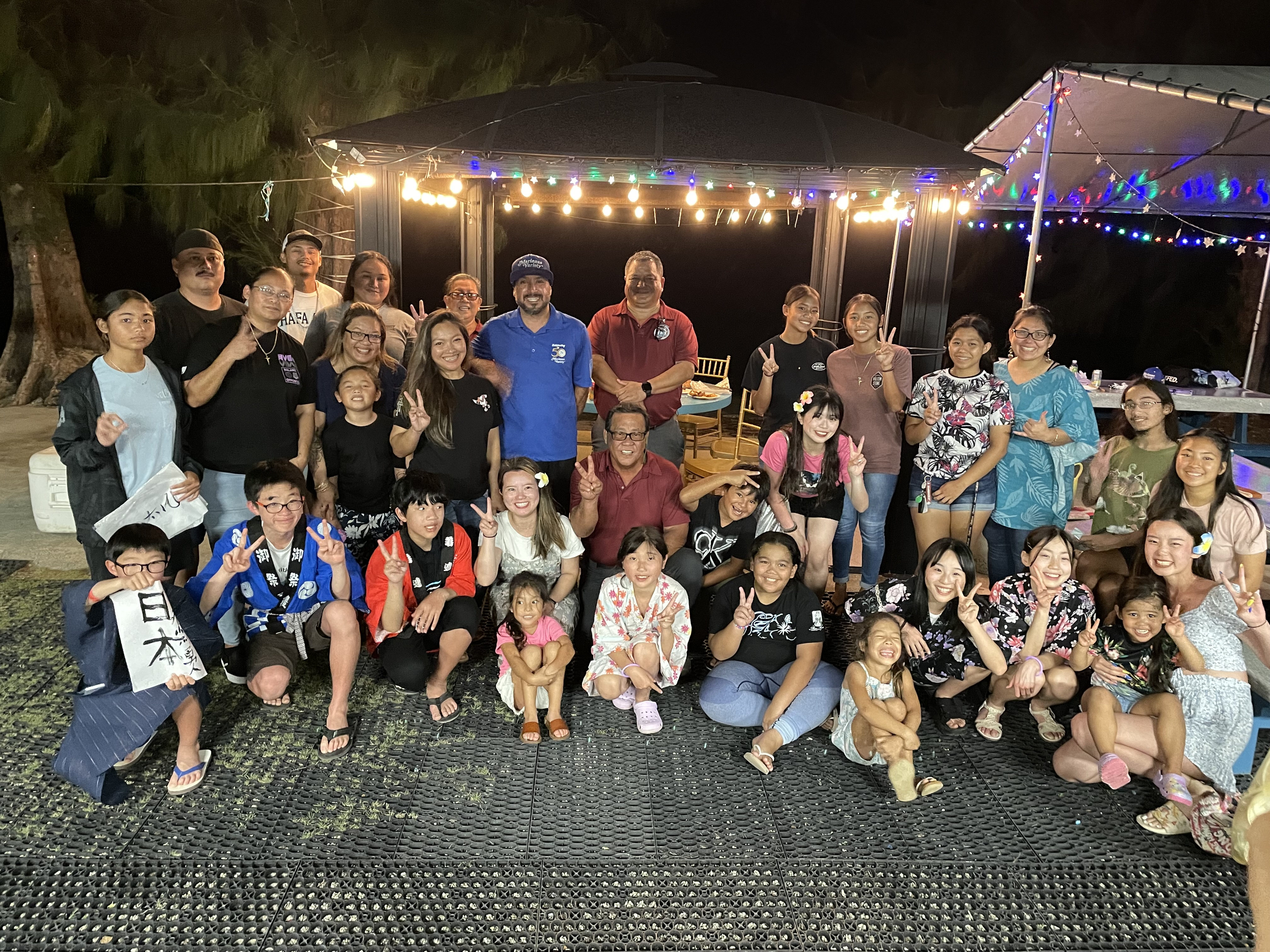 Saipan Mayor “RB” Camacho and local hosts pose for a photo with  Japanese exchange students and their chaperone during a farewell banquet hosted the Saipan Mayor’s Office on Monday.