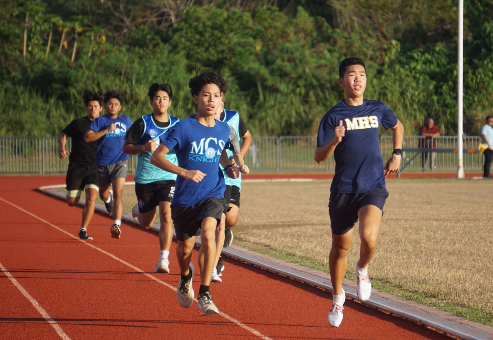 Mount Carmel School’s Victor Santos and Marianas High School’s Pony Tang battle for the lead in the U18 800m event of the PSS All School Track & Field (Athletics) SY23-24 at the Oleai Sports Complex on Wednesday.