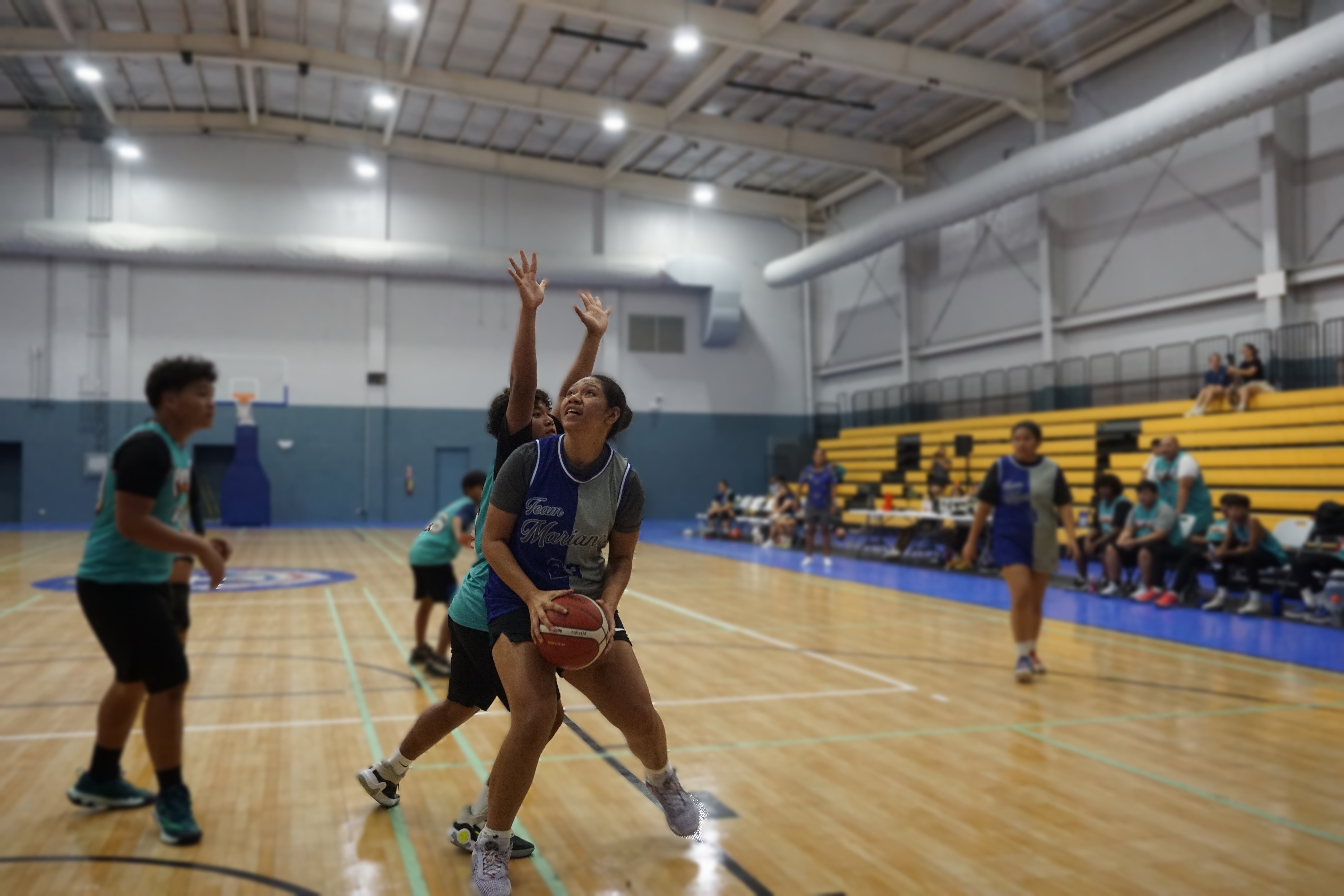 Team Marianas' Azzy Fatialofa backs down a defender in the post during a game against Prospects in the Pokka Cup 2024 at the Ada gym on Friday.