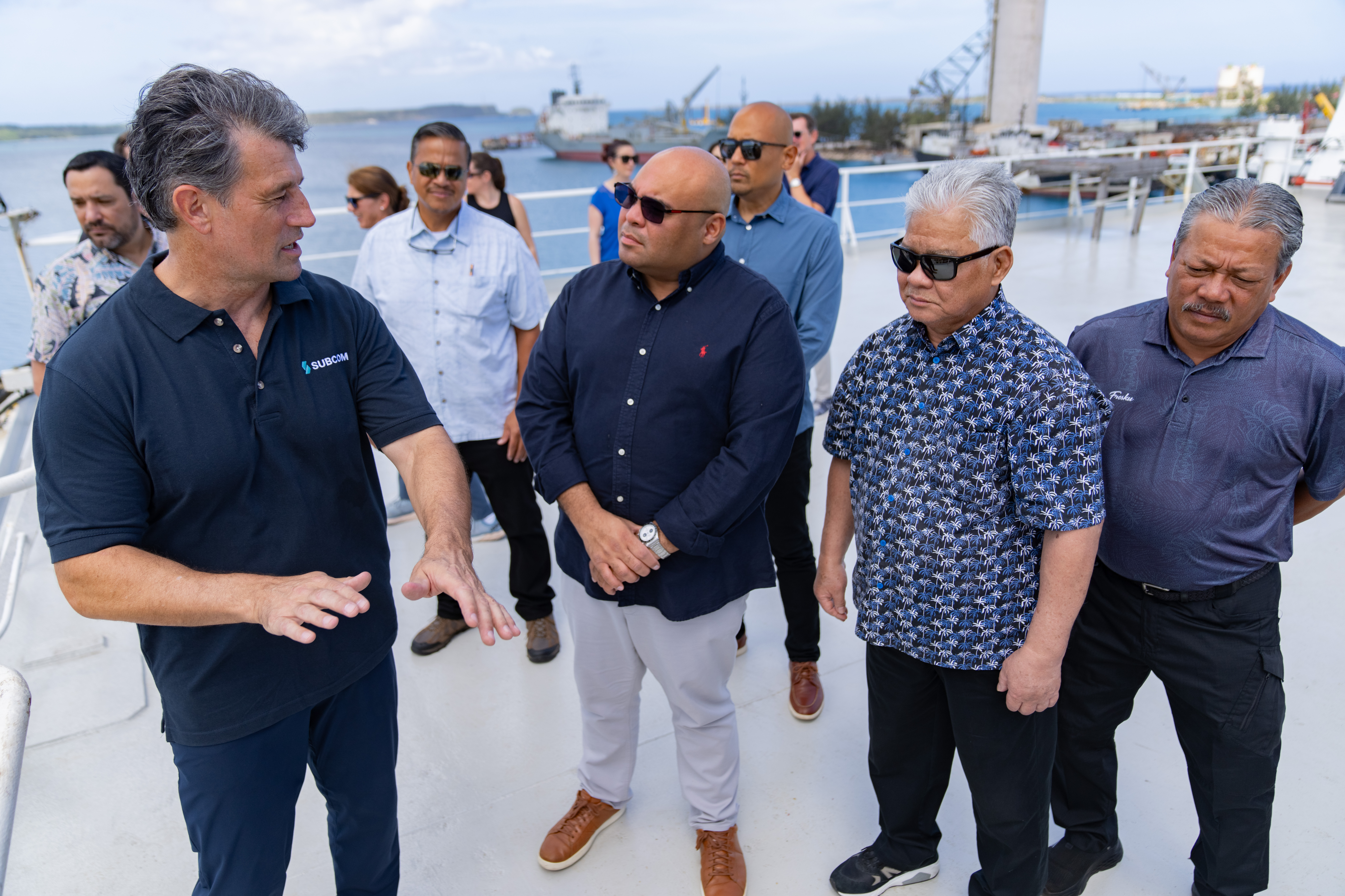 On Sunday, April 14, 2024, CNMI Governor Arnold I. Palacios, Tinian Mayor Edwin Aldan and Sen. Jude Hofschneider joined Guam Lt. Gov. Josh Tenorio, Rear Adm. Gregory Huffman, Google Network Infrastructure Regional Network Lead Yan Tang (not in photo), Citadel CEO Jim Beighley, and Special Assistant for Broadband Policy Development Glen Hunter onboard SubCom’s CS Dependable vessel, which is involved in the laying of subsea fiber cables through the Marianas. In the photo, SubCom Captain Yann Durieux, left, talks about the project.
