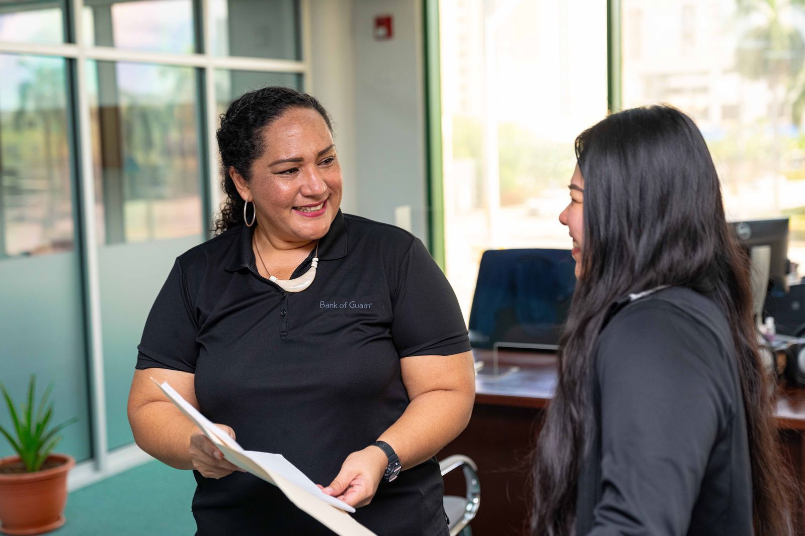 Tania David, left, the manager of Bank of Guam’s Garapan branch, is a graduate of Northern Marianas College’s School of Business.