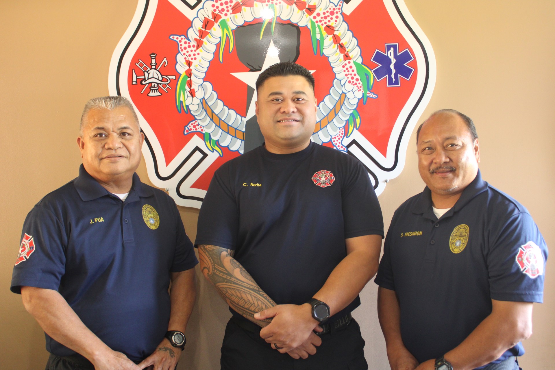 Department of Fire & Emergency Medical Services Assistant Chief Cody T. Norita, center, with DFEMS Commissioner Juan Pua, left, and Deputy Commissioner Steve Mesngon.