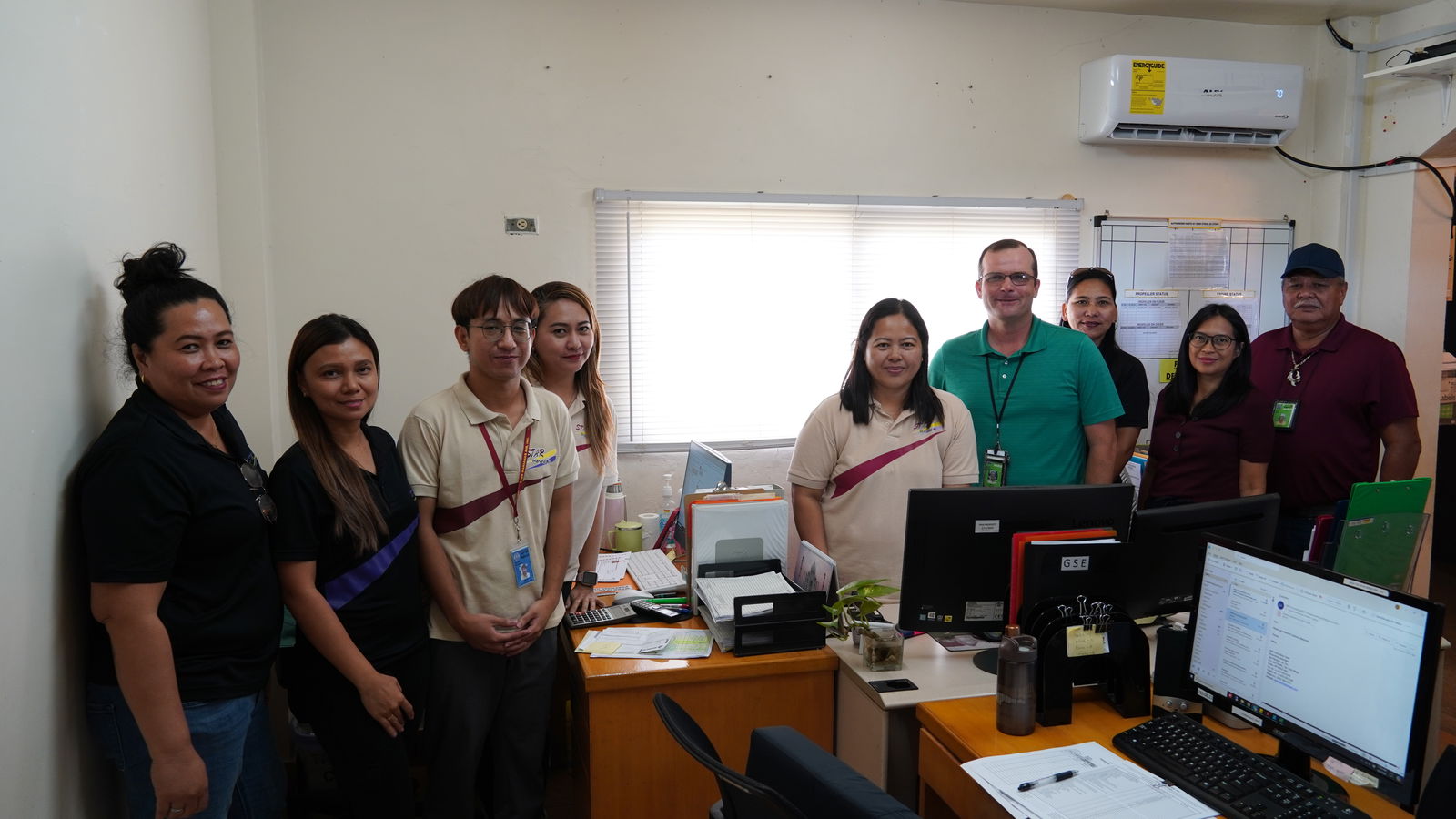 Shaun Christian (in green shirt) with the SMA's Procurement and Admin Department