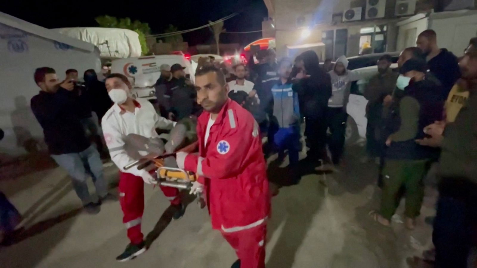 Paramedics move the body of a World Central Kitchen worker April 1, 2024. 