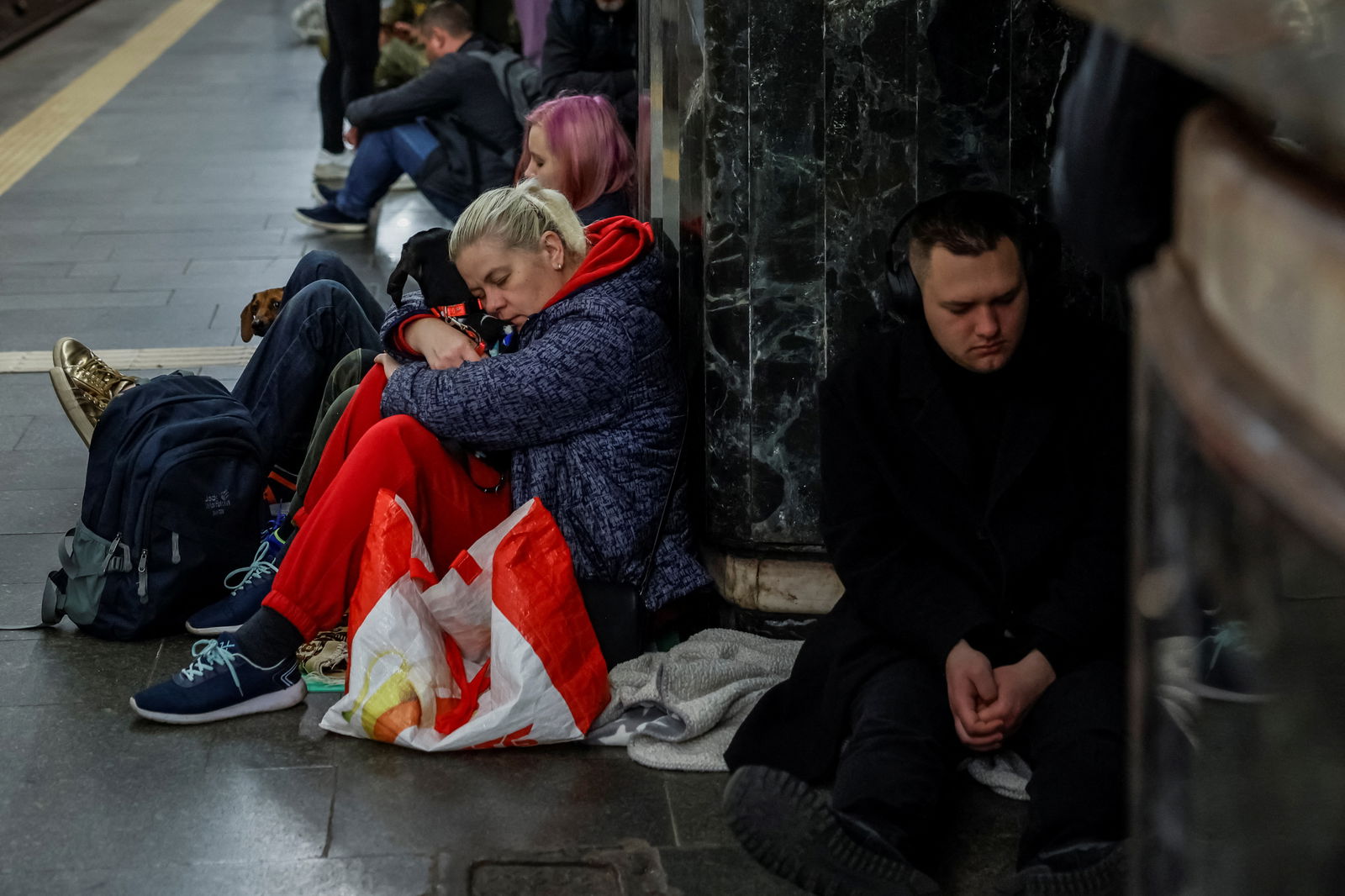 People take shelter inside a metro station with their pets during a Russian missile strike, amid Russia's attacks on Ukraine, in Kyiv, Ukraine, April 11, 2024. 